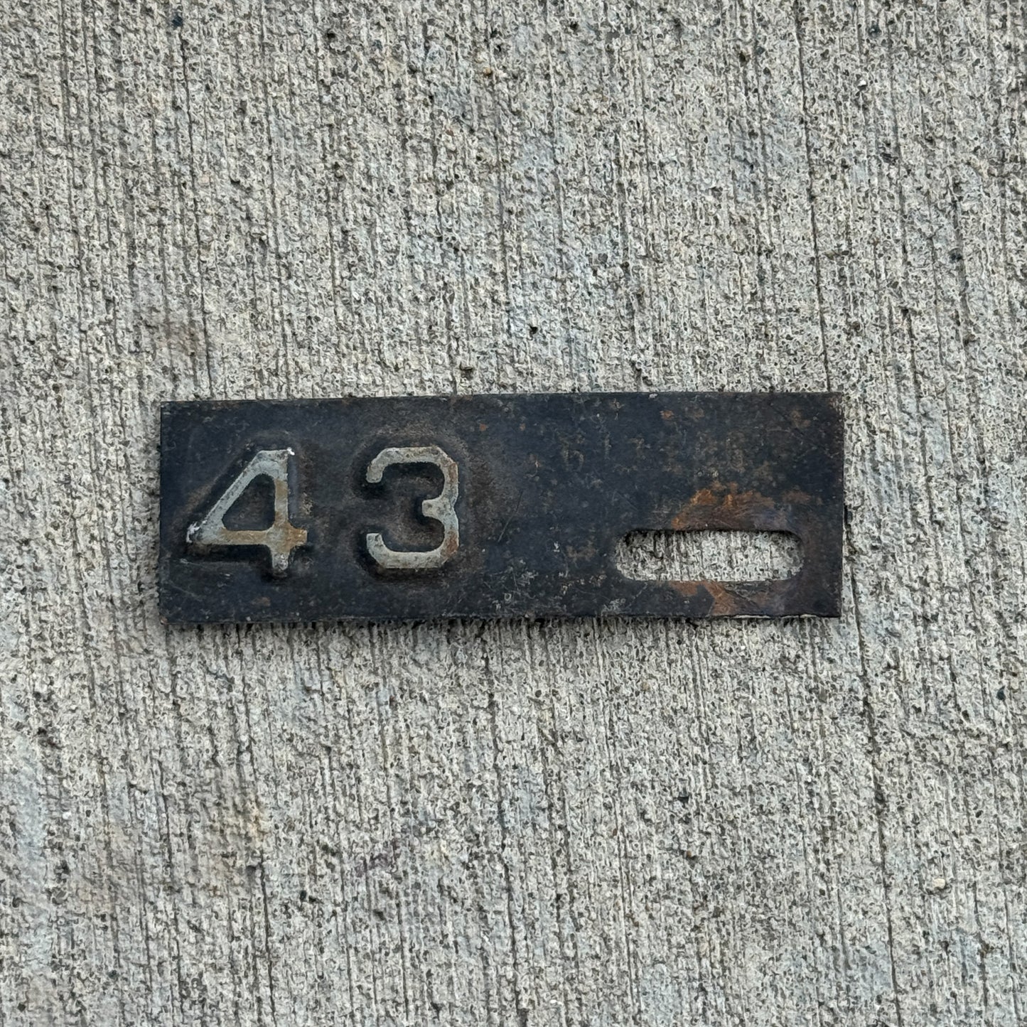 Photo of a 1943 New Jersey Tab License Plate Auto Tag Garage Decor Vintage with original patina
