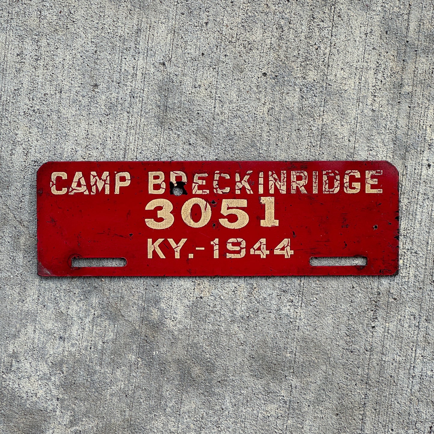 Photo of a 1944 Camp Breckinridge Kentucky License Plate Topper Auto Tag Garage Decor Vintage Military Hard Fiberboard 3051 with original patina