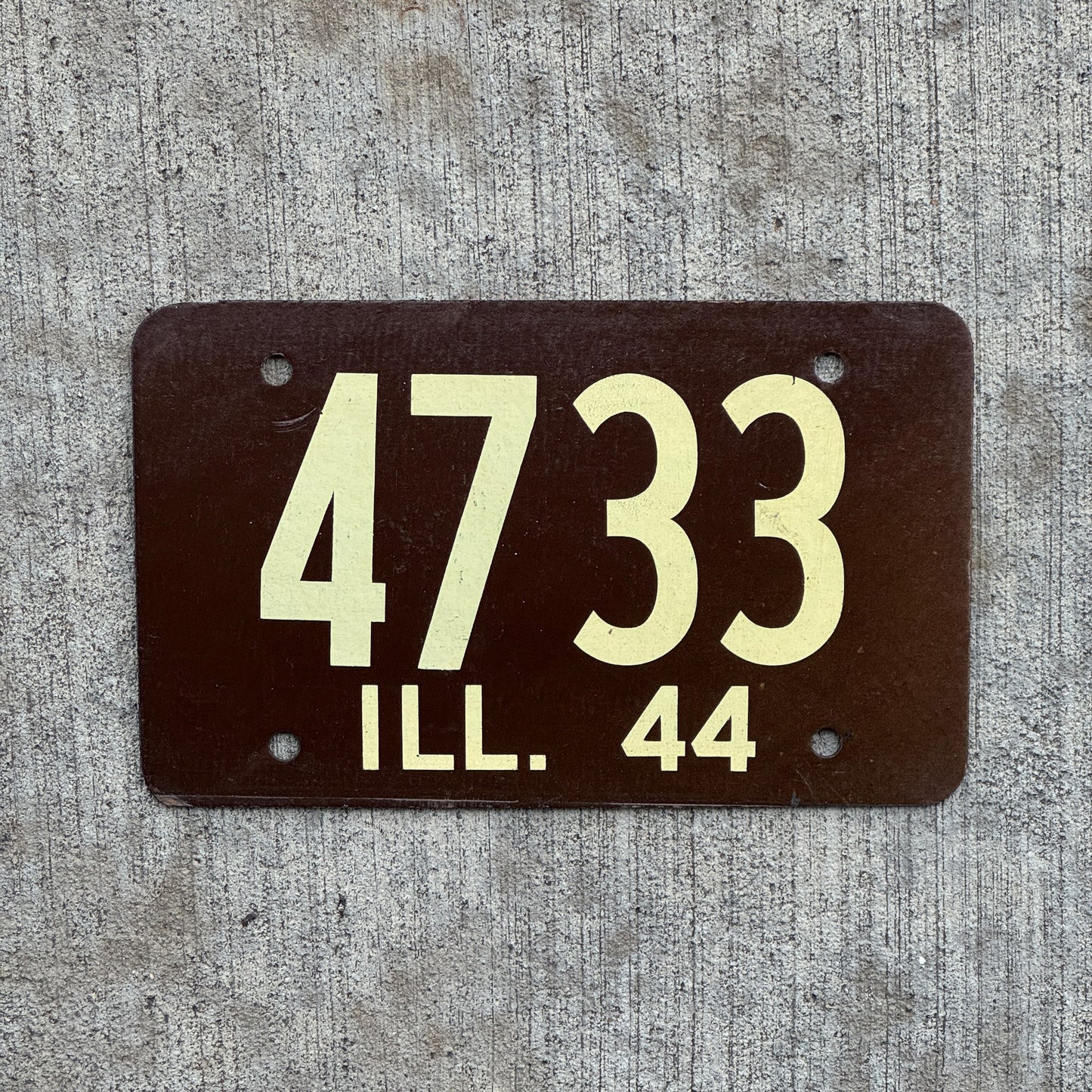 Photo of a 1944 Illinois License Plate Auto Tag Garage Decor Vintage Fiberboard Low Number Four Digit 4733 with original patina