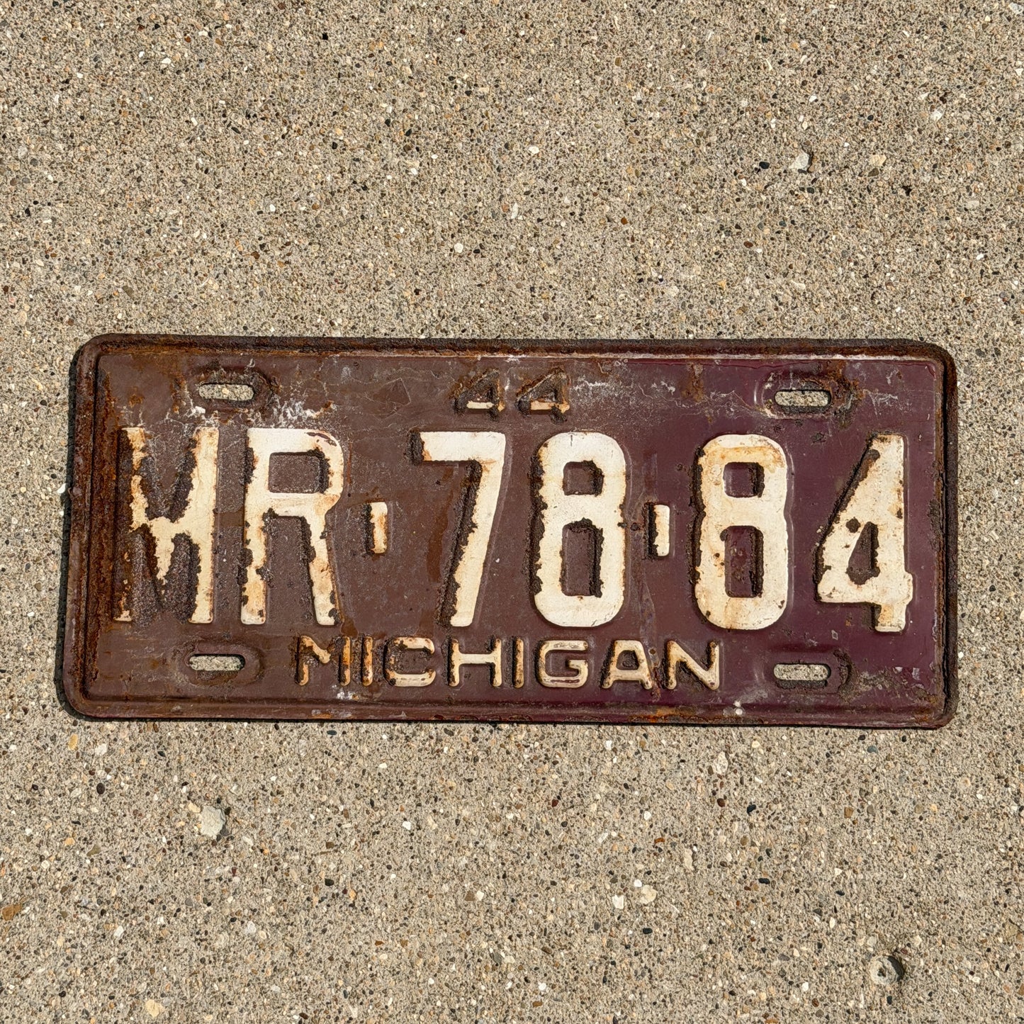 Photo of a 1944 Michigan License Plate Auto Tag Garage Decor Vintage MR 78 84 with original patina