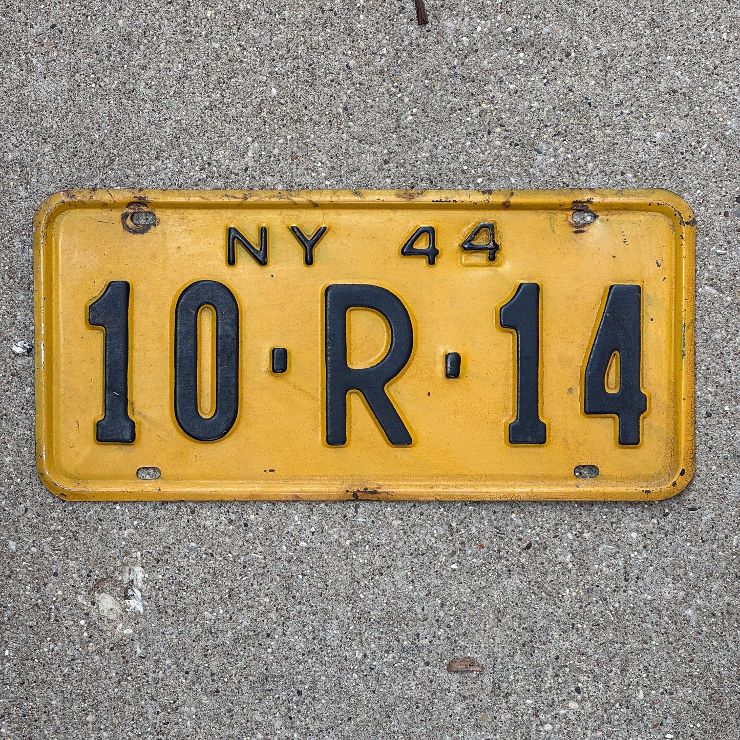 Photo of a 1944 New York License Plate Auto Tag Garage Decor Vintage Restamp WWII 10 R 14