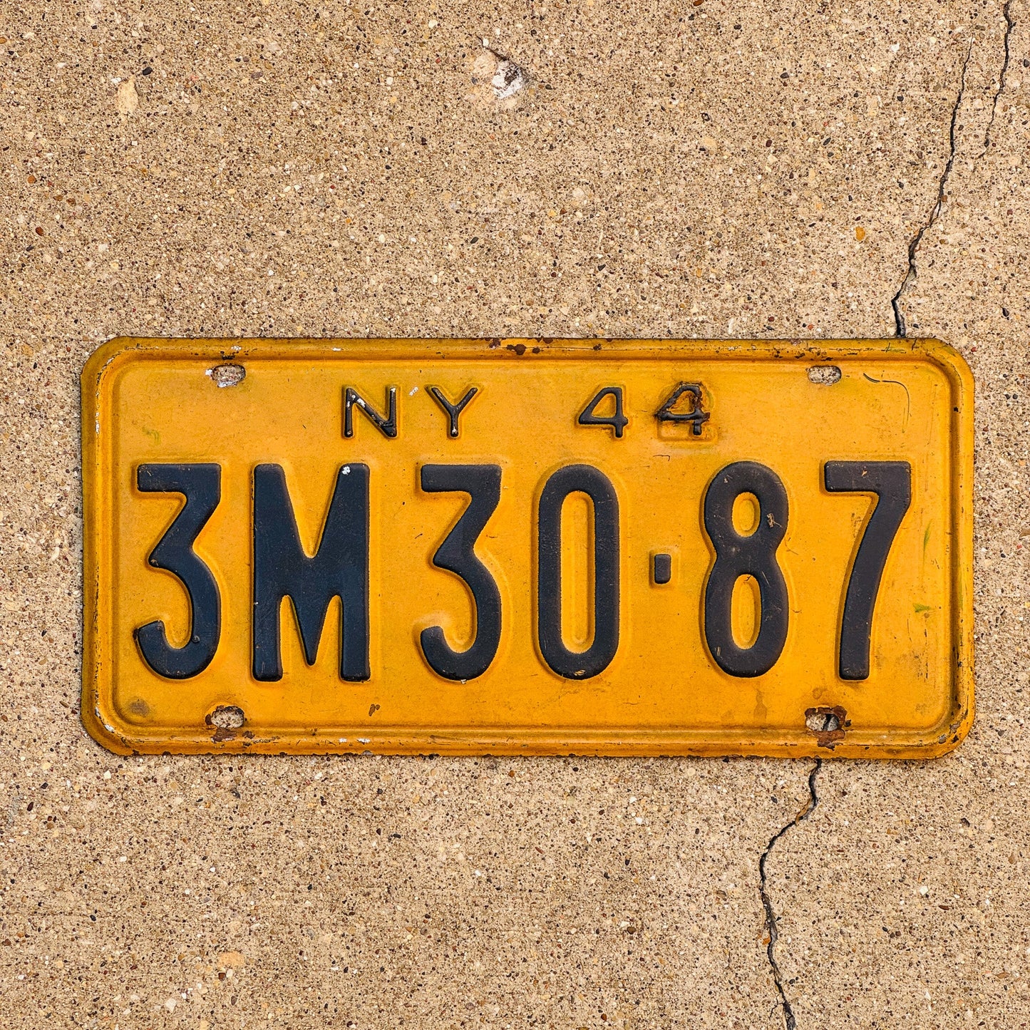 Photo of a 1944 New York License Plate Auto Tag Garage Decor Vintage Restamp WWII 3M 3087