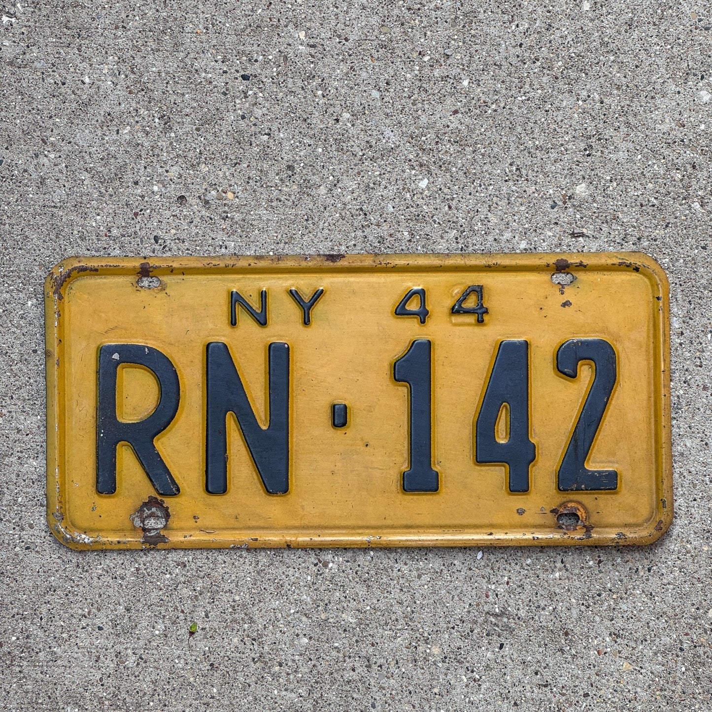 Photo of a 1944 New York License Plate Auto Tag Garage Decor Vintage Restamp WWII RN 142