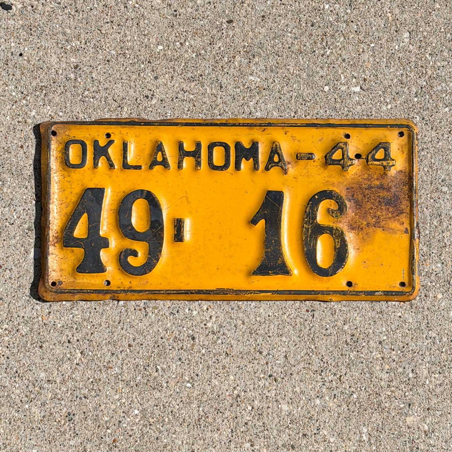 Photo of a 1944 Oklahoma License Plate Auto Tag Garage Decor Vintage Blaine County Low Number 49 16 with original patina