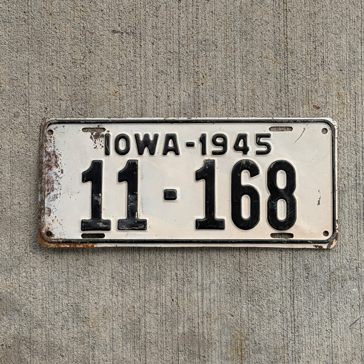Photo of a 1945 Iowa License Plate Auto Tag Garage Decor Vintage 11 168 with original patina