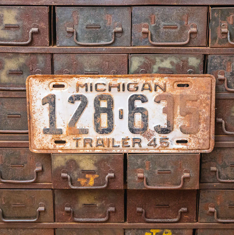 Photo of a 1945 Michigan Trailer License Plate Auto Tag Garage Decor Vintage 128 635 with original patina