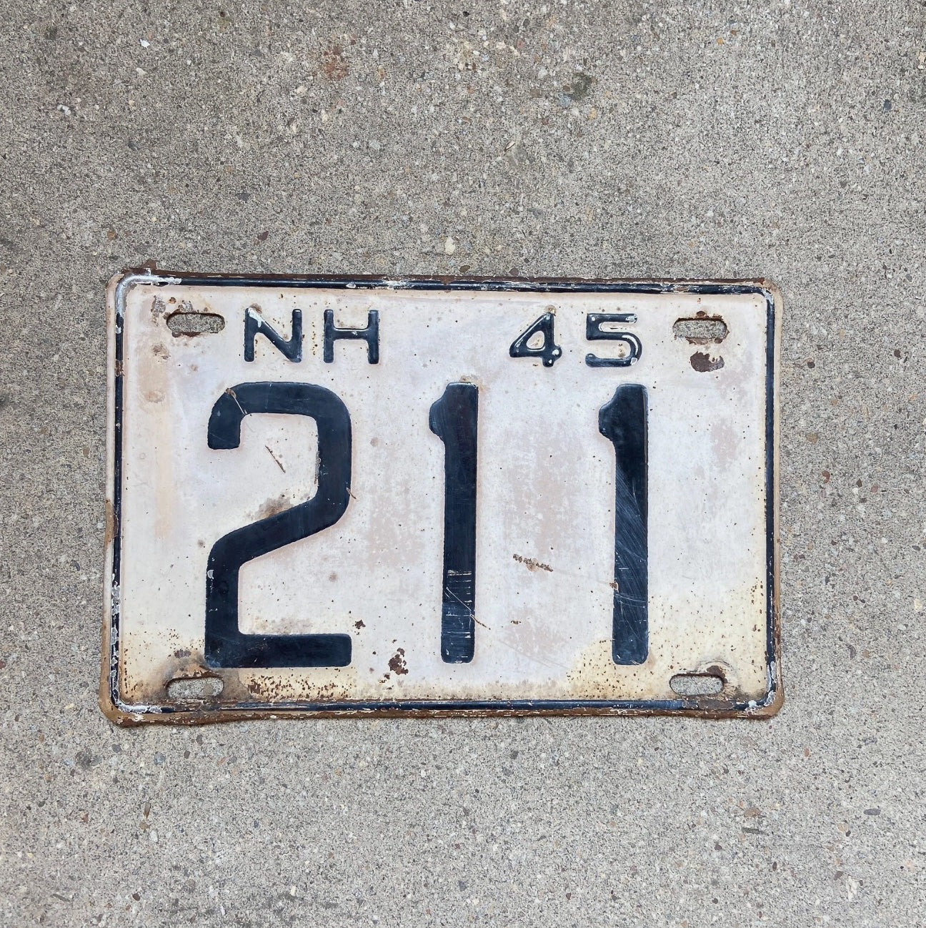 Photo of a 1945 New Hampshire License Plate Auto Tag Garage Decor Vintage Low Number Three Digit 211 with original patina