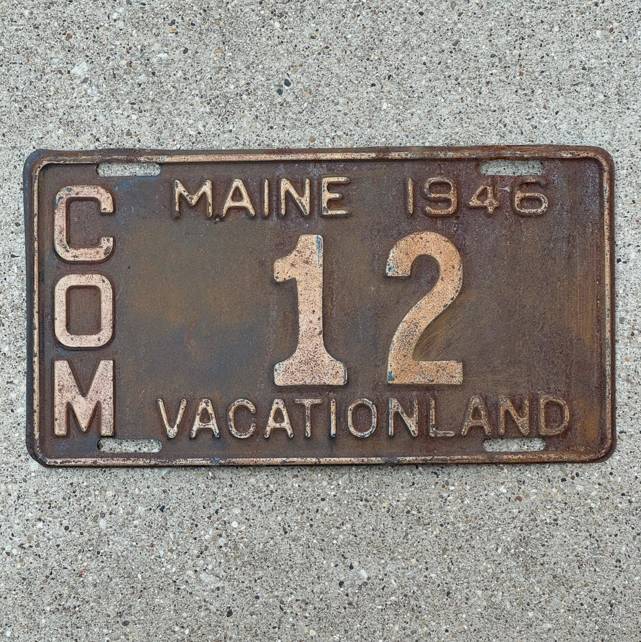 Photo of a 1946 Maine Truck License Plate Auto Tag Garage Decor Vintage Low Number Two Digit 12 with original patina