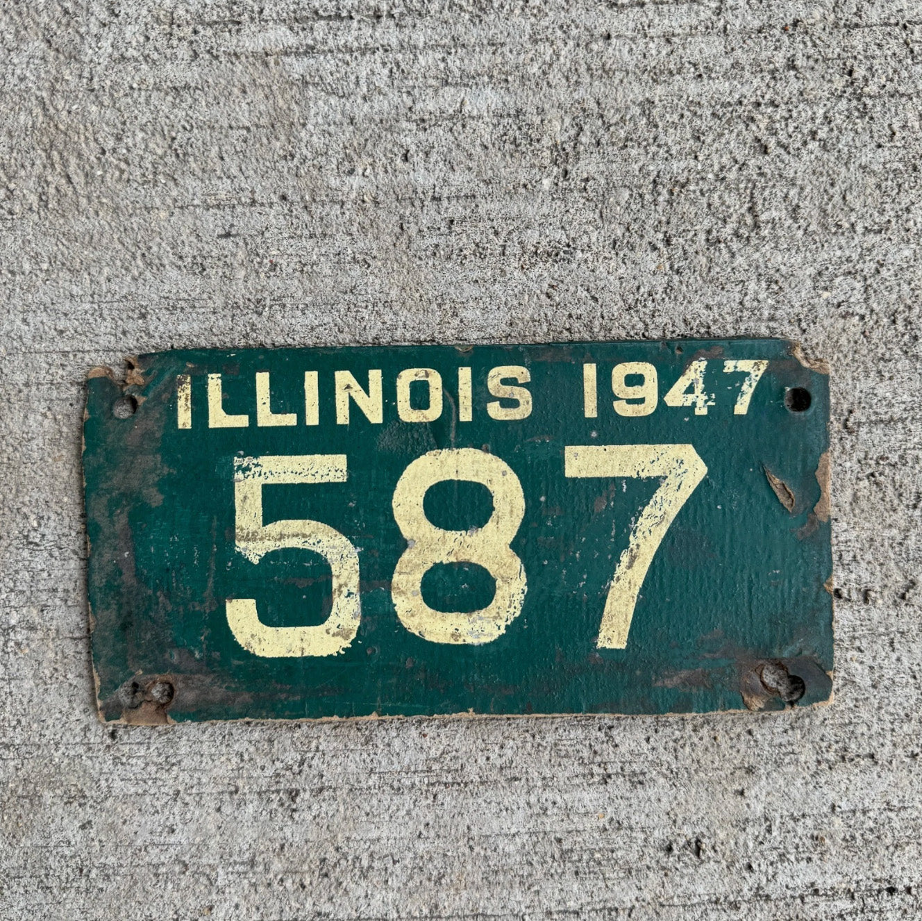Photo of a 1947 Illinois Fiberboard Motorcycle License Plate Auto Tag Garage Decor Vintage Low Number Three Digit 587 with original patina