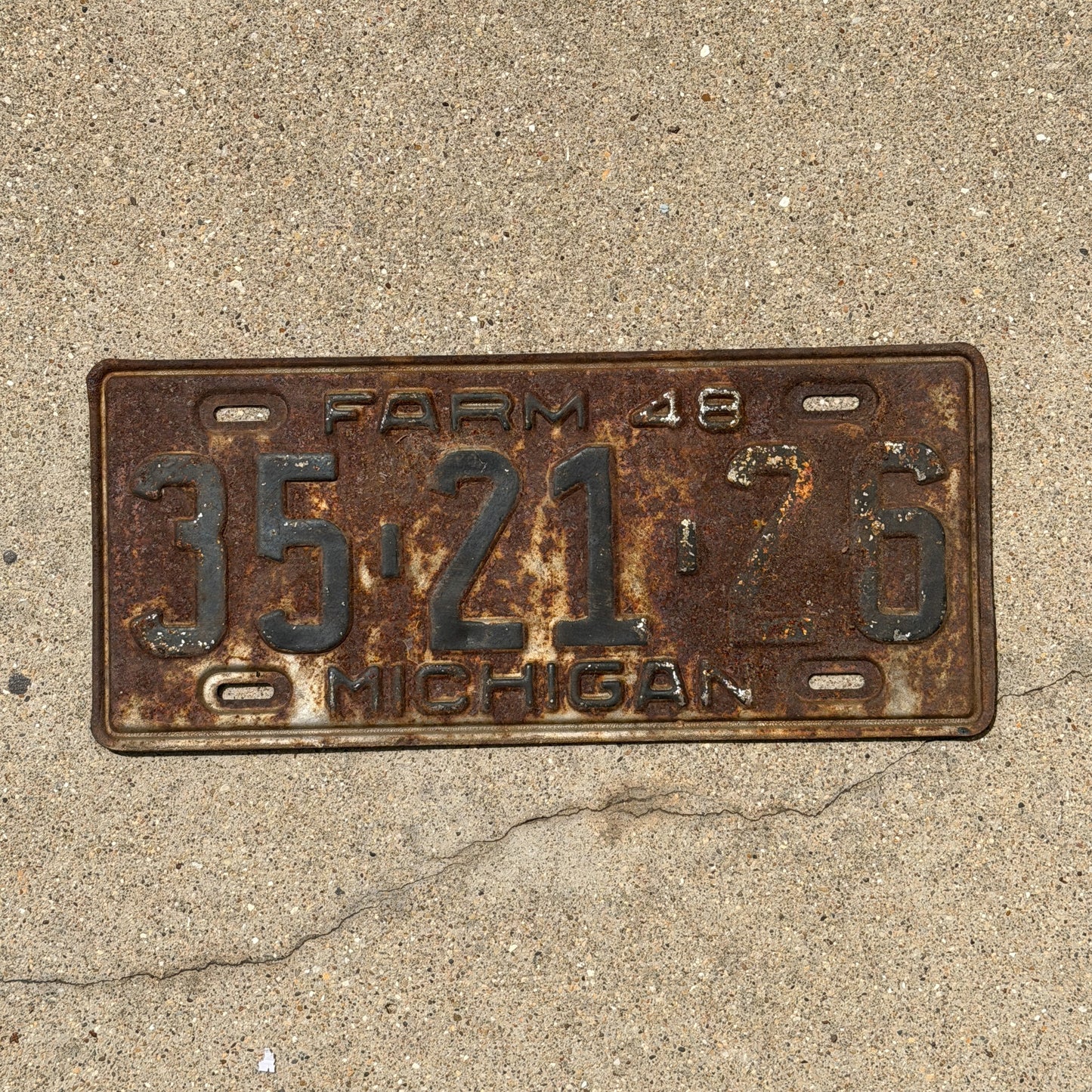 Photo of a 1948 Michigan Farm License Plate Auto Tag Garage Decor Vintage 35 21 26 with original patina