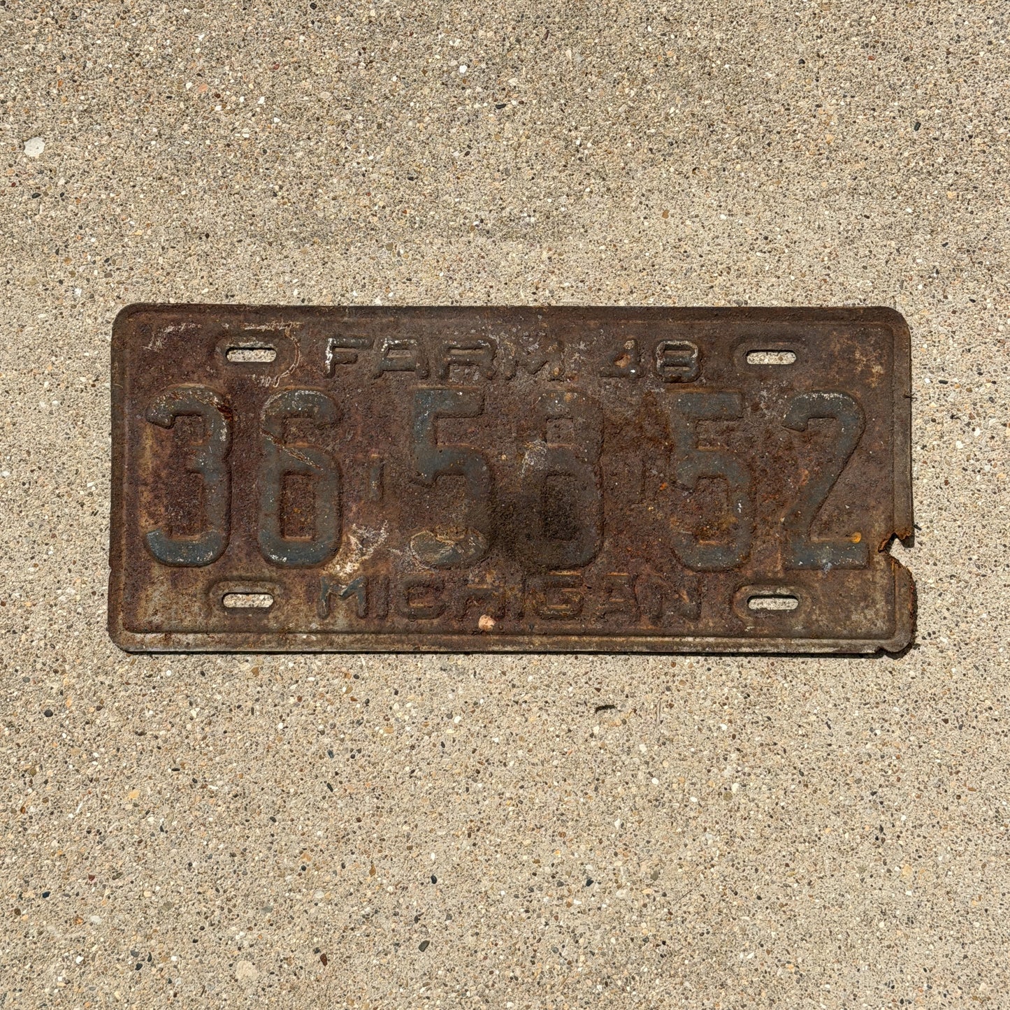Photo of a 1948 Michigan Farm License Plate Auto Tag Garage Decor Vintage 36 58 52 with original patina