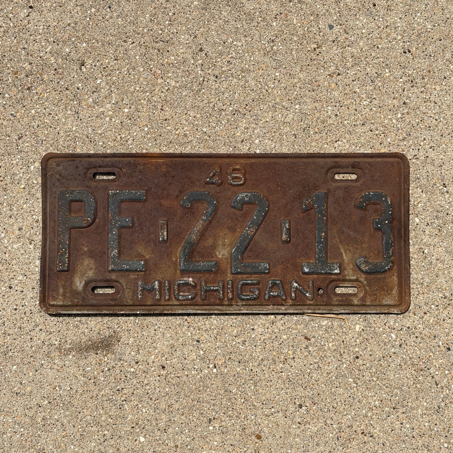 Photo of a 1948 Michigan License Plate Auto Tag Garage Decor Vintage PE 22 13 with original patina