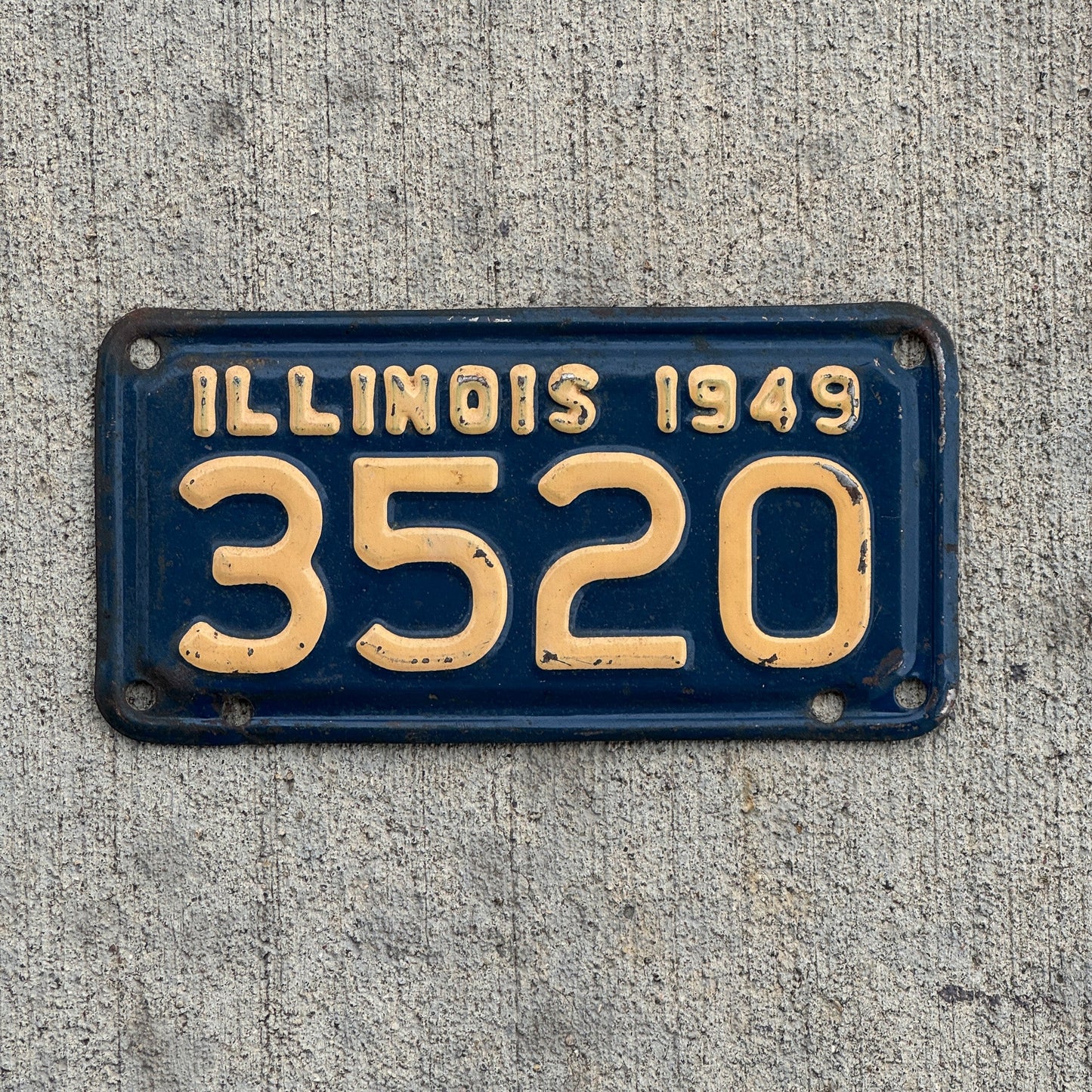 Photo of a 1949 Illinois Motorcycle License Plate Auto Tag Garage Decor Vintage Low Number Four Digit 3520 with original patina