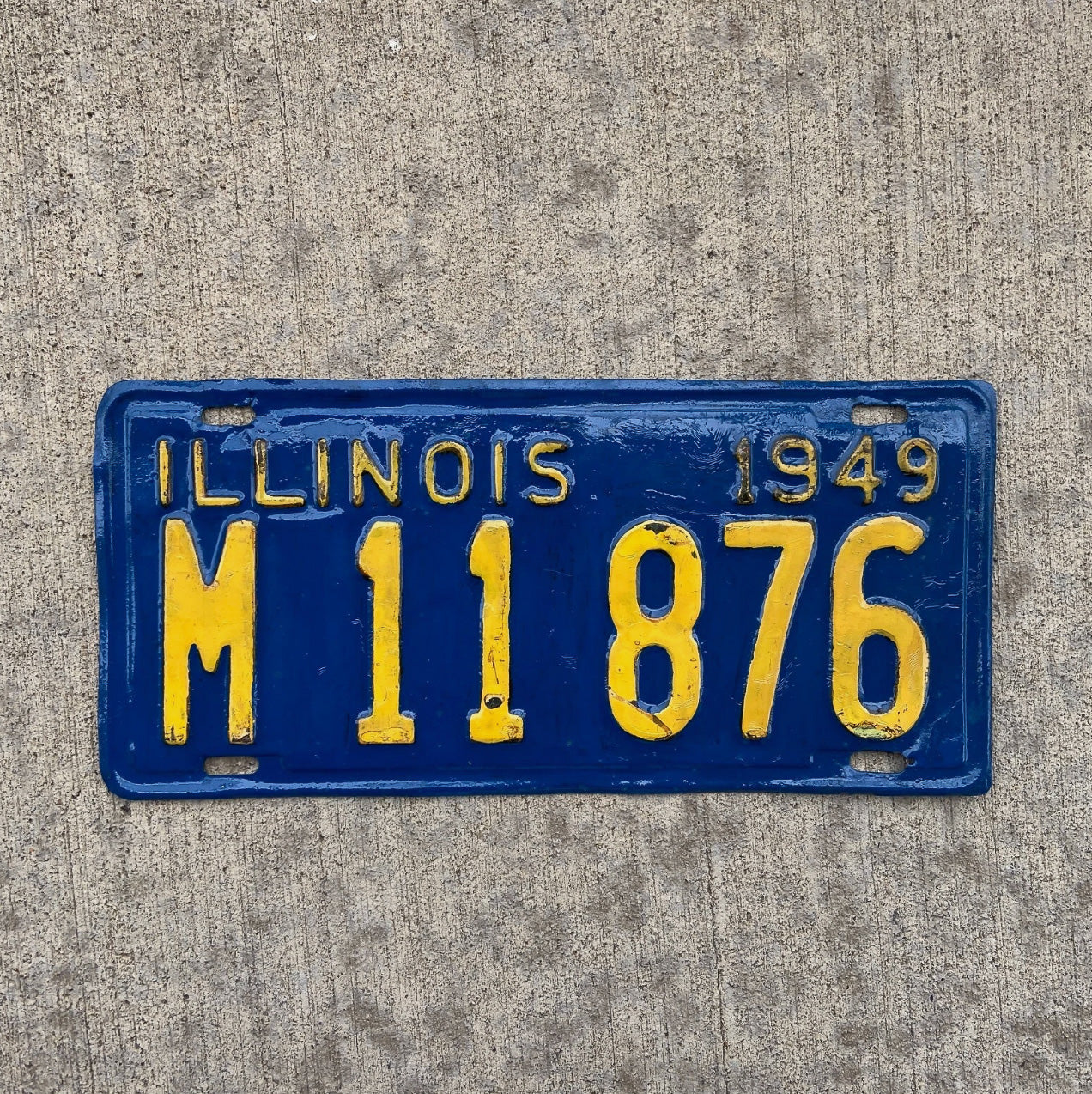 Photo of a 1949 Illinois Municipal License Plate Auto Tag Garage Decor Vintage Public Owned M 11876 with original patina