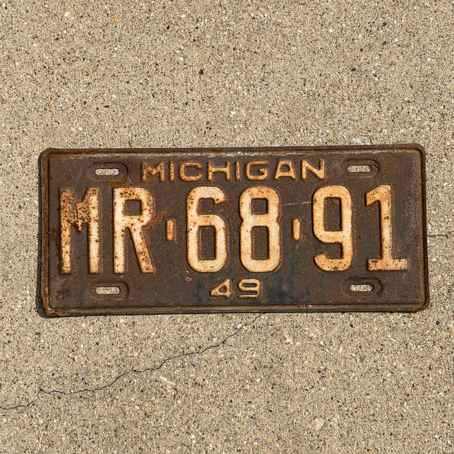 Photo of a 1949 Michigan License Plate Auto Tag Garage Decor Vintage MR 68 91 with original patina
