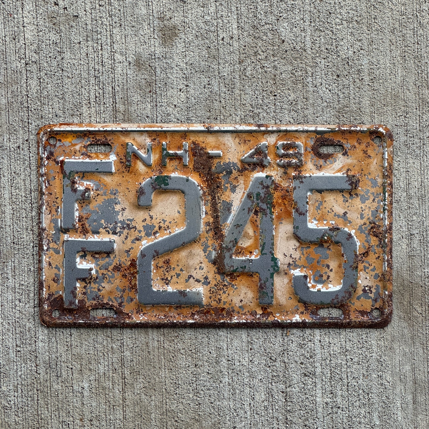 Photo of a 1949 New Hampshire License Plate Auto Tag Garage Decor Vintage Strafford County FF 245 with original patina