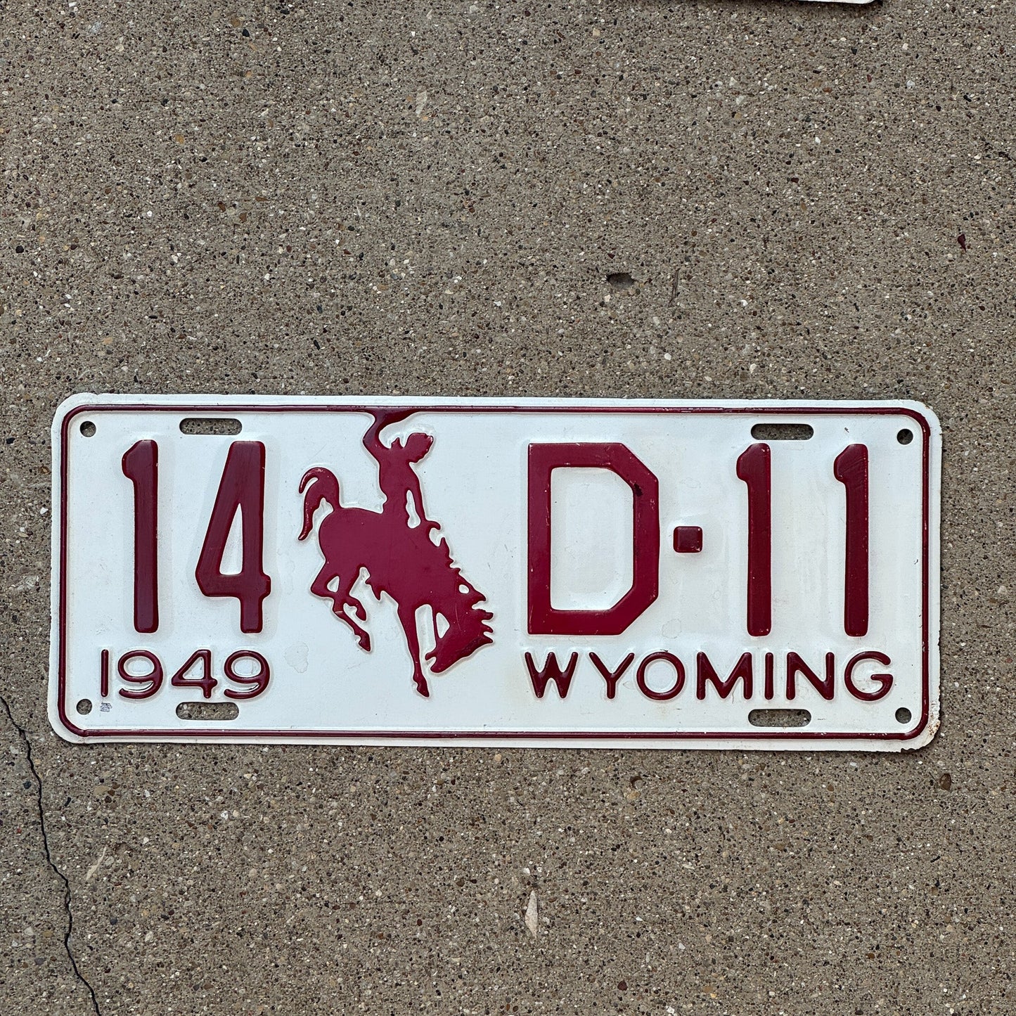Photo of a 1949 Wyoming Dealer License Plate Auto Tag Garage Decor Vintage 14 D 11