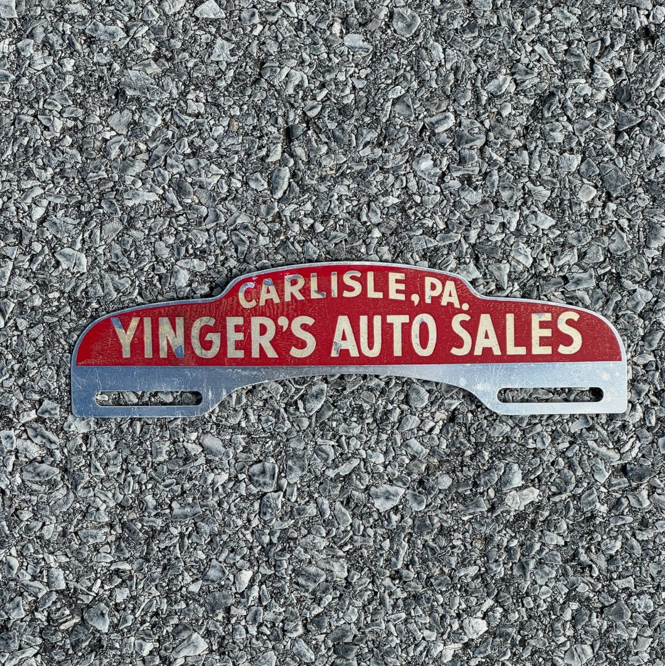 Photo of a 1950 Era Carlisle Pennsylvania License Plate Topper Tag Yinger's Auto Sales Dealer with original patina