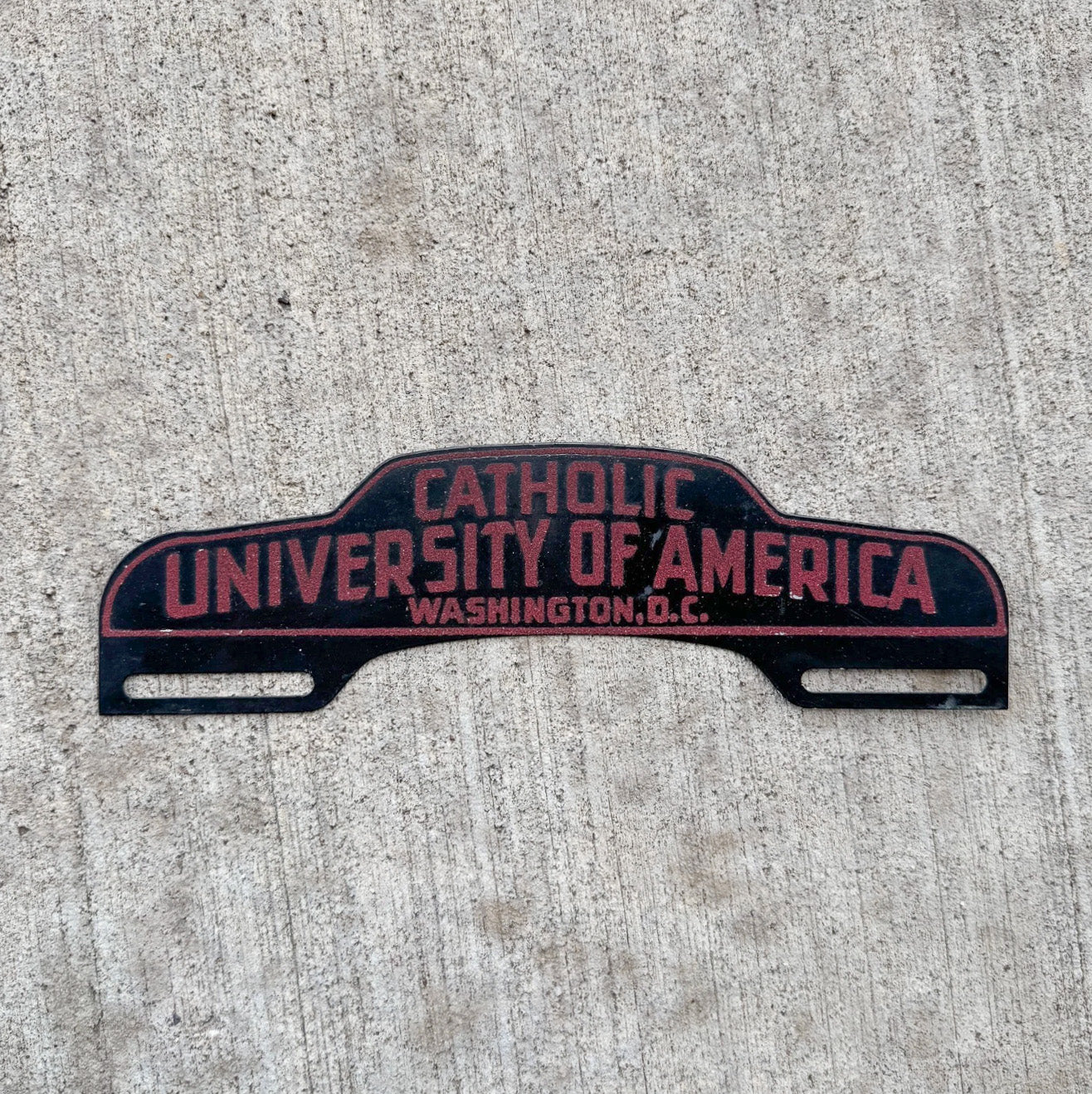 Photo of a 1950 Era Catholic University Washington DC License Plate Topper Auto Tag Garage Decor Vintage Washington DC College Smaltz Paint with original patina