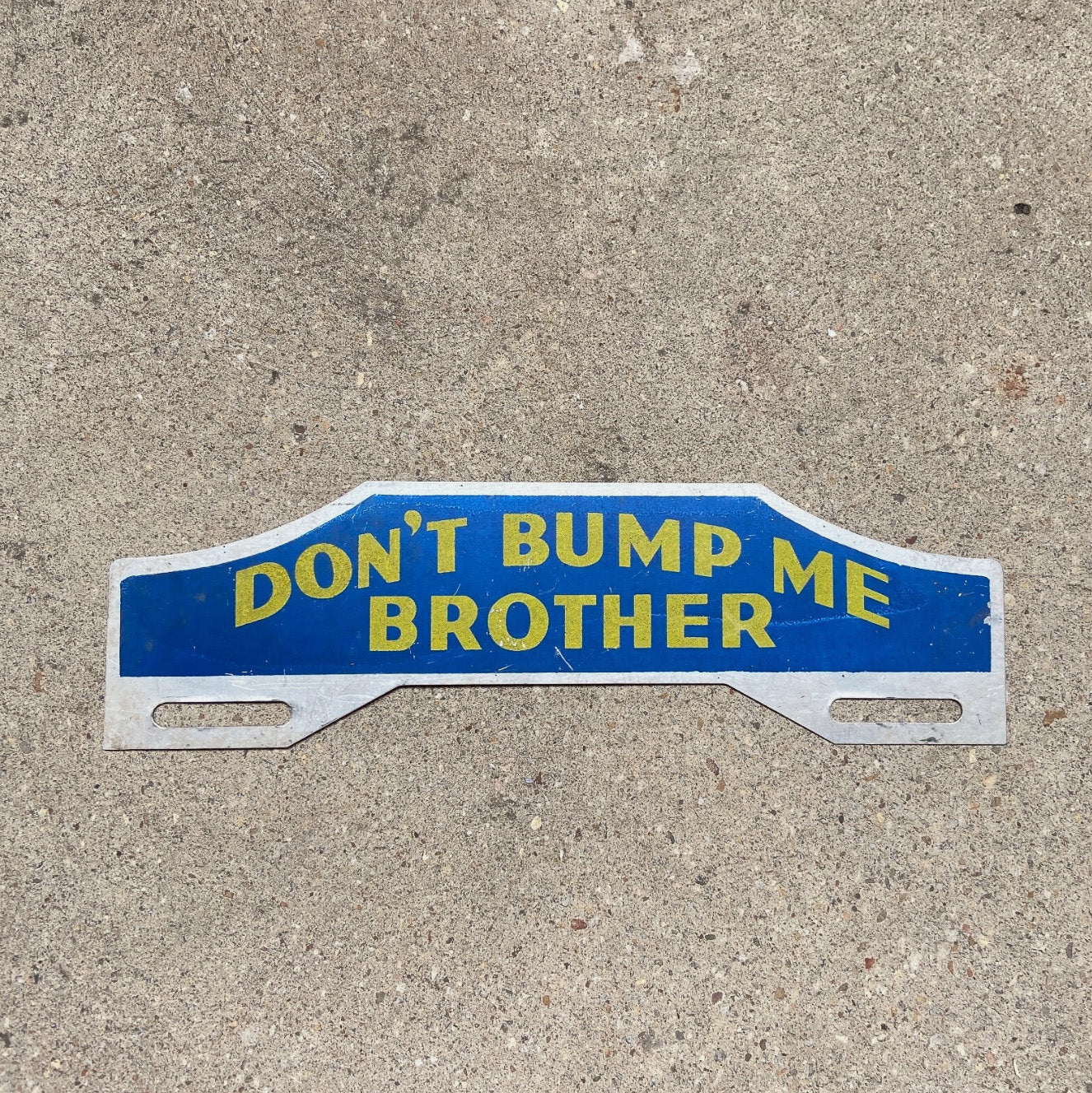 Photo of a 1950 Era Don't Bump Me Brother License Plate Topper Auto Tag Garage Decor Vintage Car Auto Decor Accident with original patina