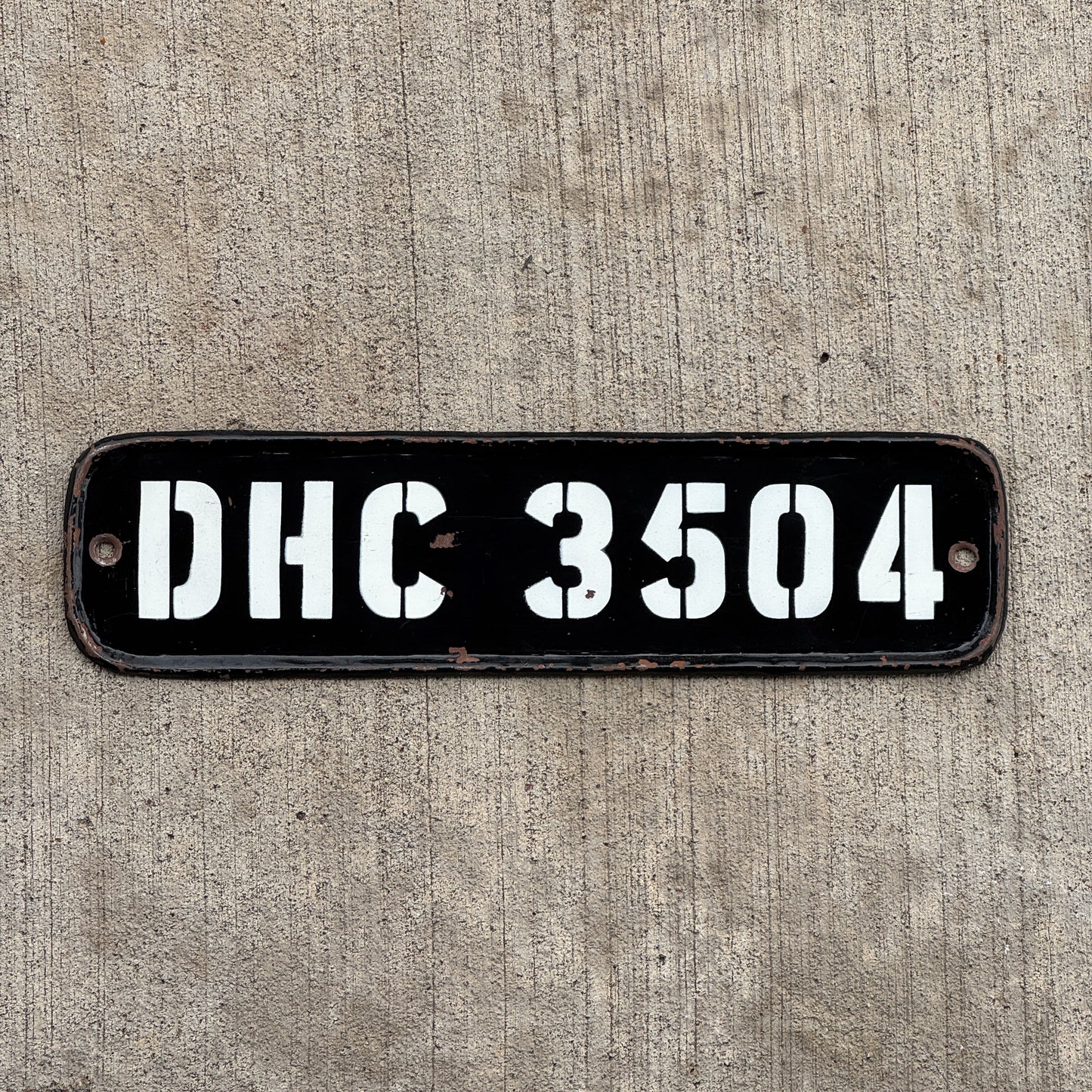 Photo of a 1950 Era India License Plate Auto Tag Garage Decor Vintage National Capital Territory Delhi DHC 3504 with original patina