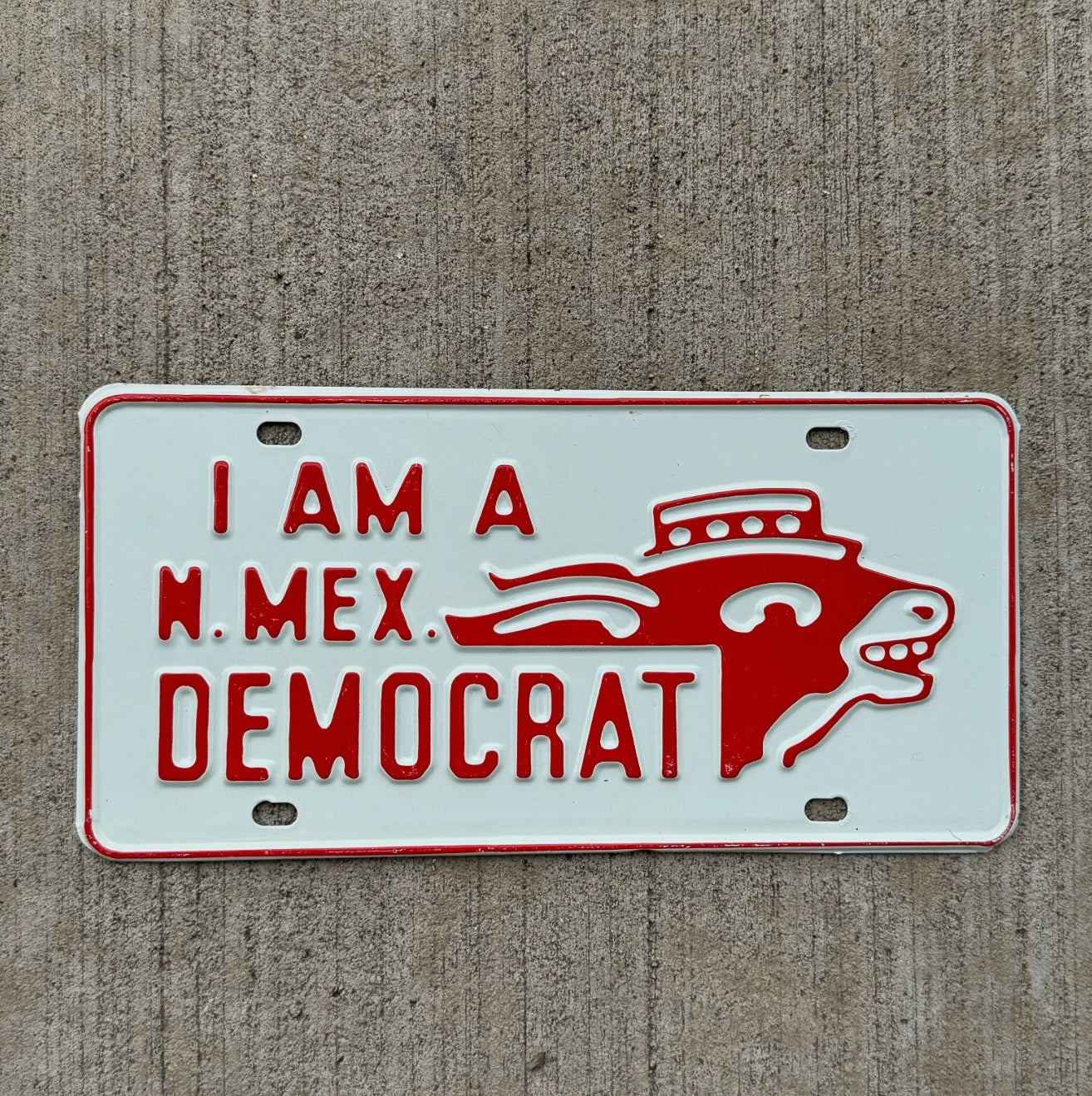 Photo of a 1950 Era New Mexico Booster License Plate Auto Tag Garage Decor Vintage Democrat Vote Politics with original patina
