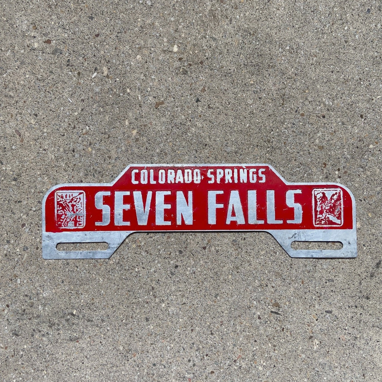 Photo of a 1950 Era Seven Falls Colorado License Plate Topper Auto Tag Garage Decor Vintage Denver Colo Springs Broadmoor with original patina