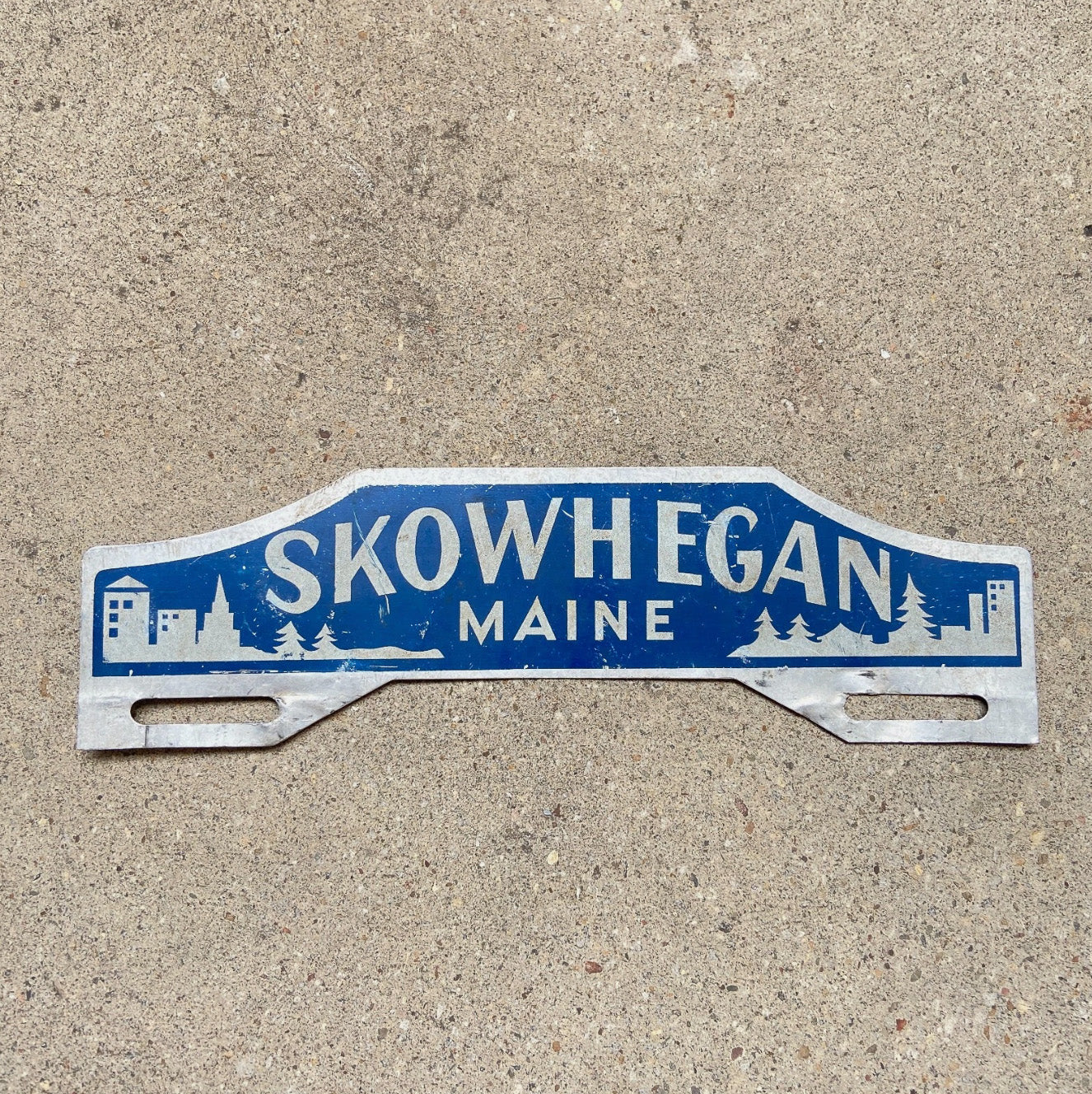 Photo of a 1950 Era Skowhegan Maine License Plate Topper Auto Tag Garage Decor Vintage Outdoors Forest Skiing Nature with original patina