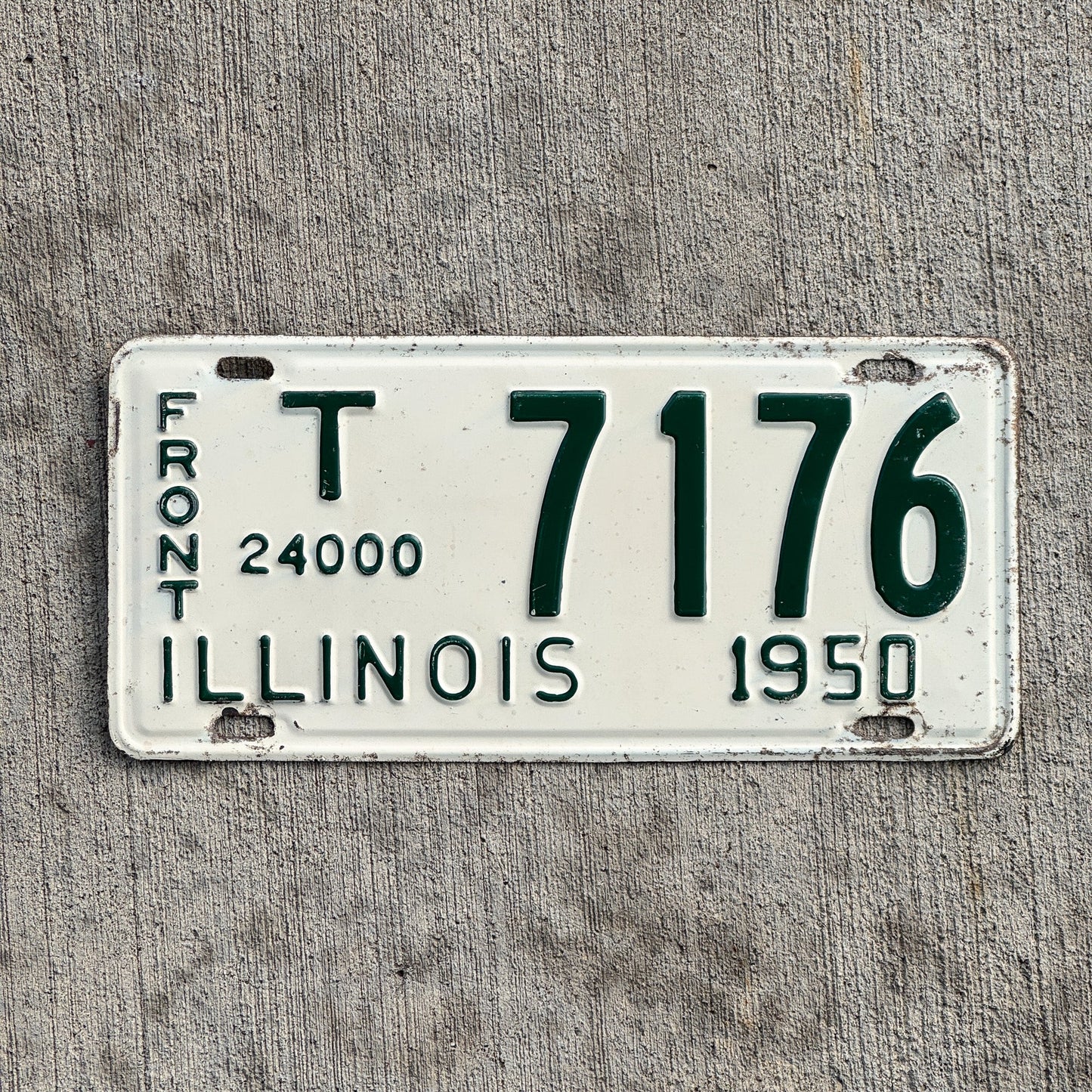 Photo of a 1950 Illinois Truck Mileage Tax Front License Plate Auto Tag 1 Vintage Garage 24000 LBS T 7176 with original patina