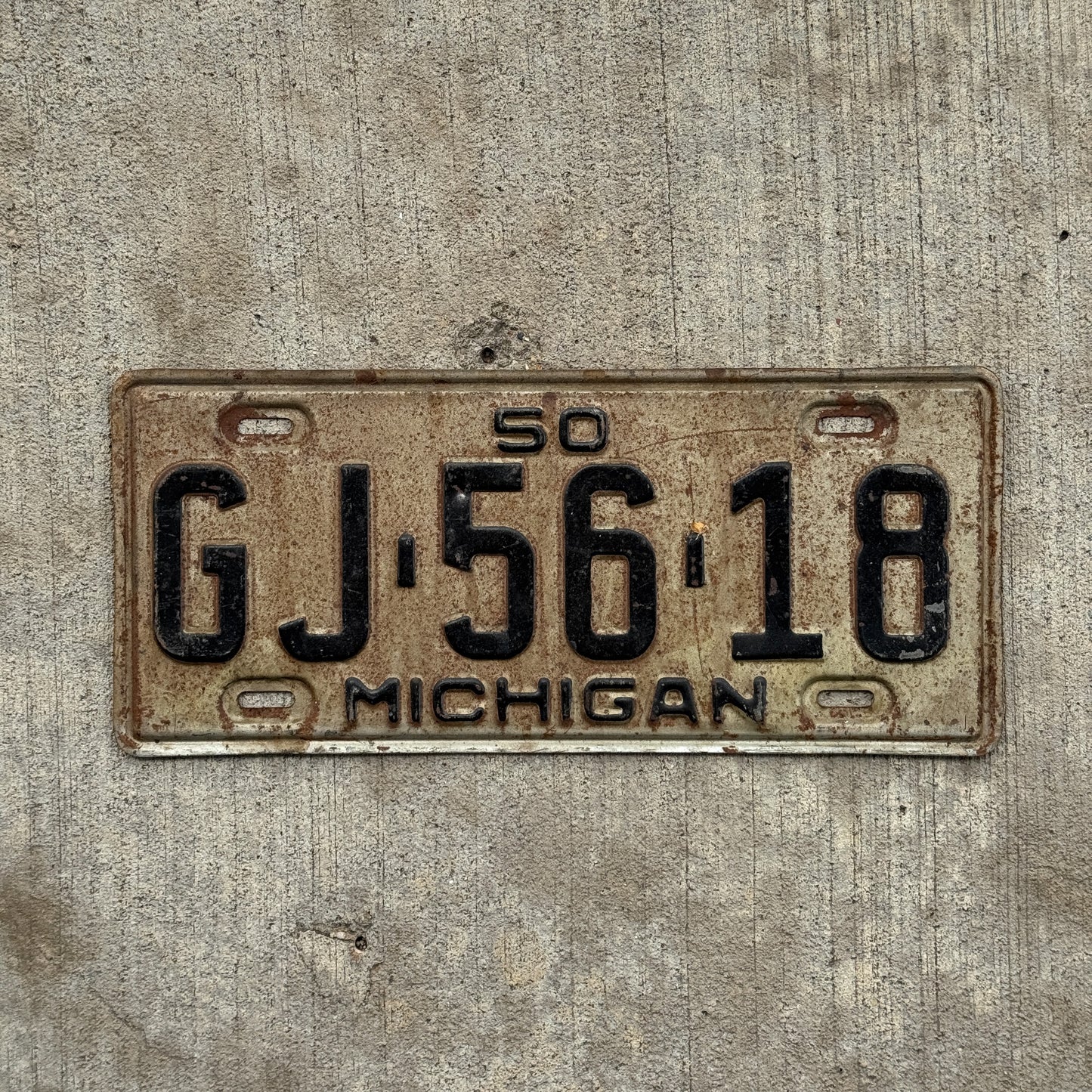 Photo of a 1950 Michigan License Plate Auto Tag Garage Decor Vintage GJ 56 18 with original patina