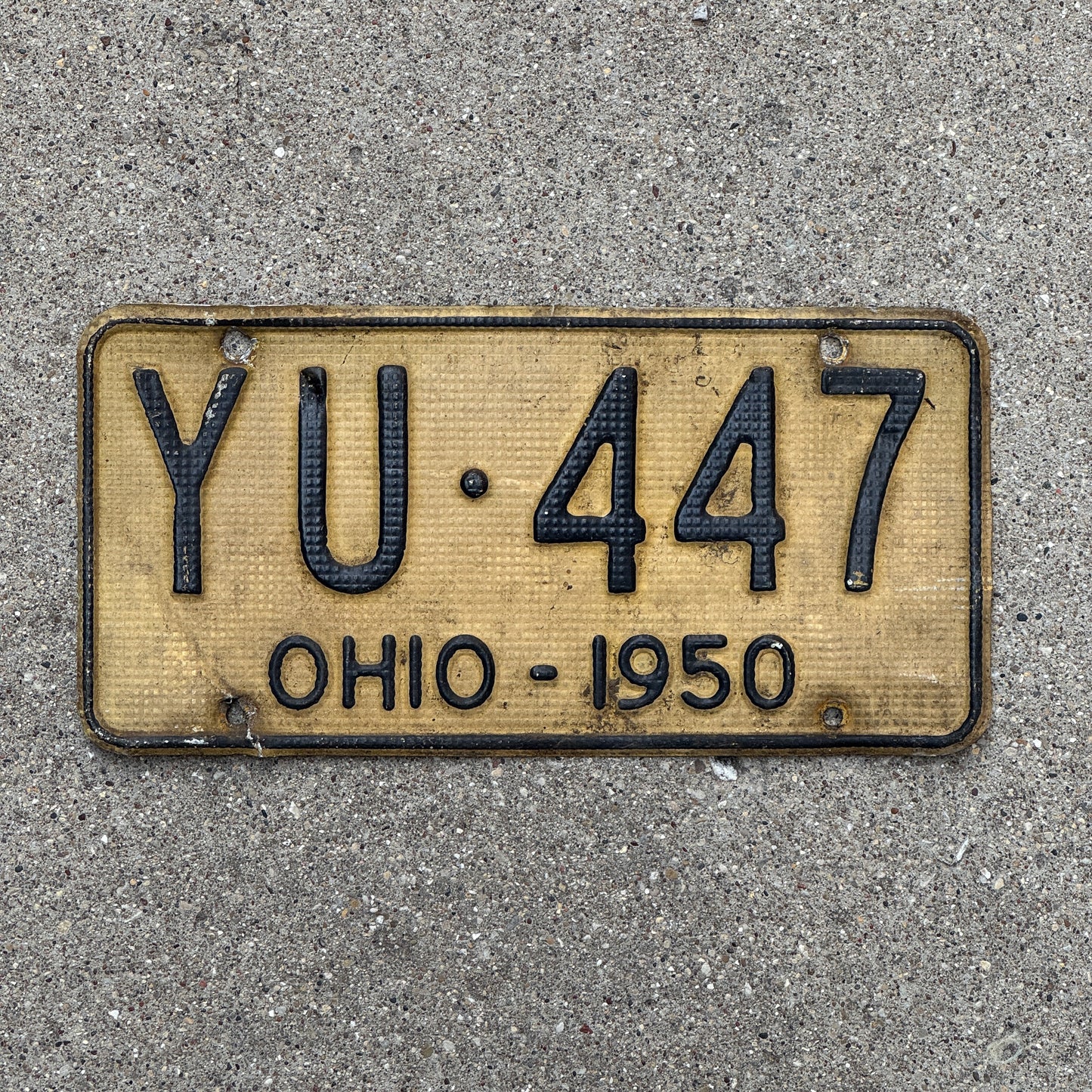 Photo of a 1950 Ohio License Plate Auto Tag Garage Decor Vintage Waffle Style YU 447 with original patina