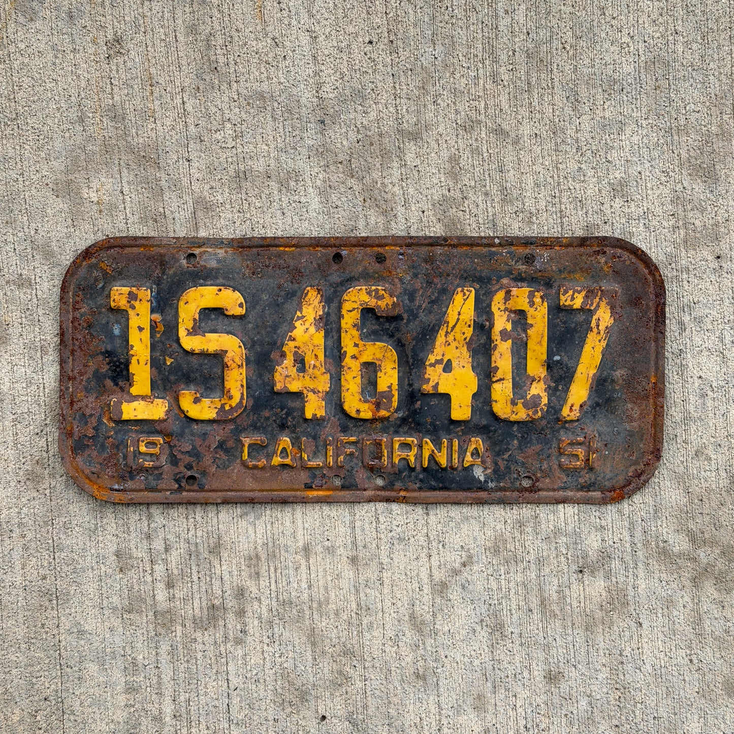 Photo of a 1951 California License Plate Auto Tag Garage Decor Vintage 1 S 46407 with original patina