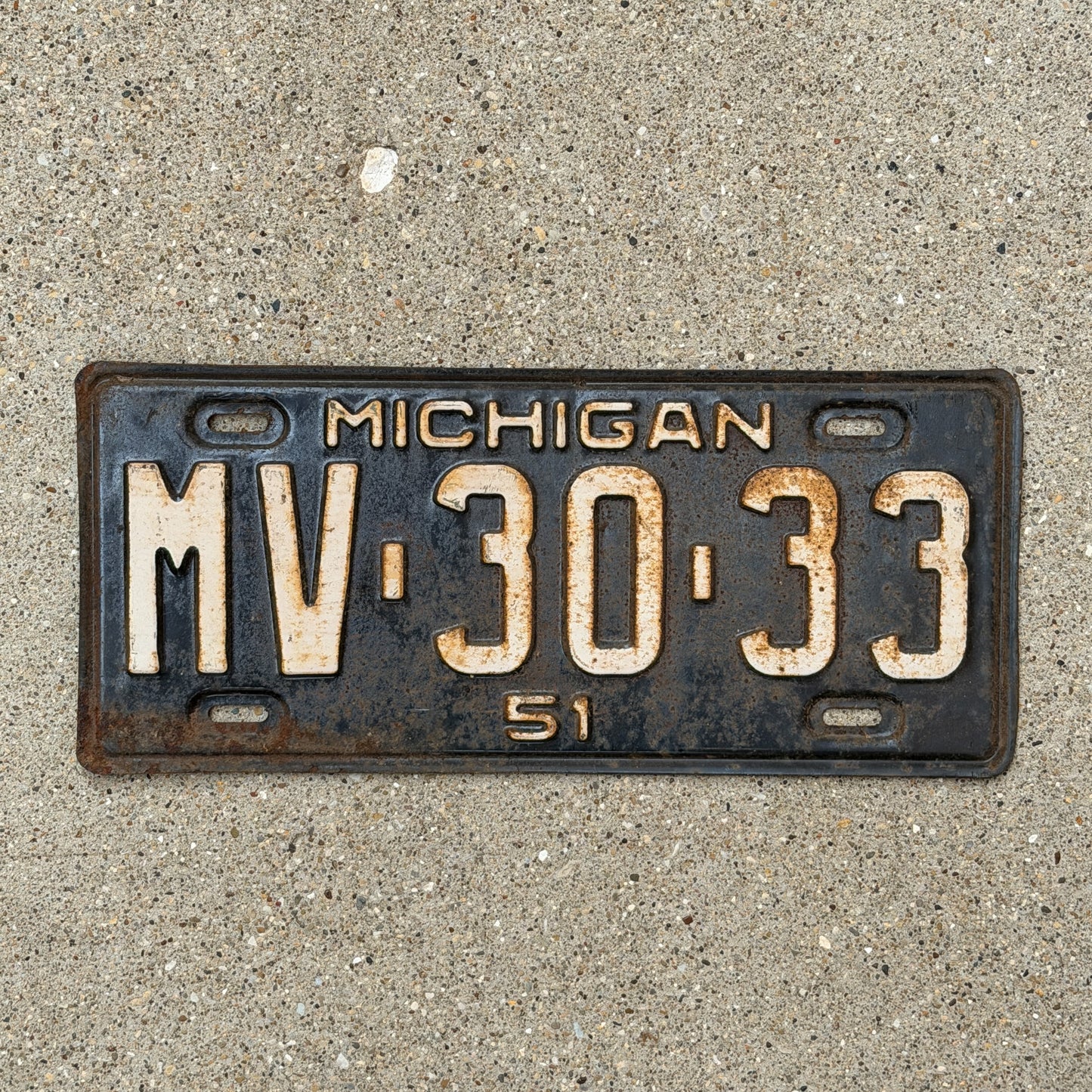 Photo of a 1951 Michigan License Plate Auto Tag Garage Decor Vintage MV 30 33 with original patina