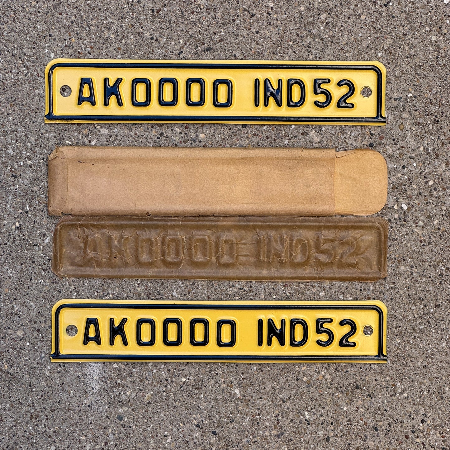 Photo of a 1952 Indiana Sample Tab License Plate Pair Auto Tag 2 Garage Decor NOS with Envelope AK 0000 with original patina