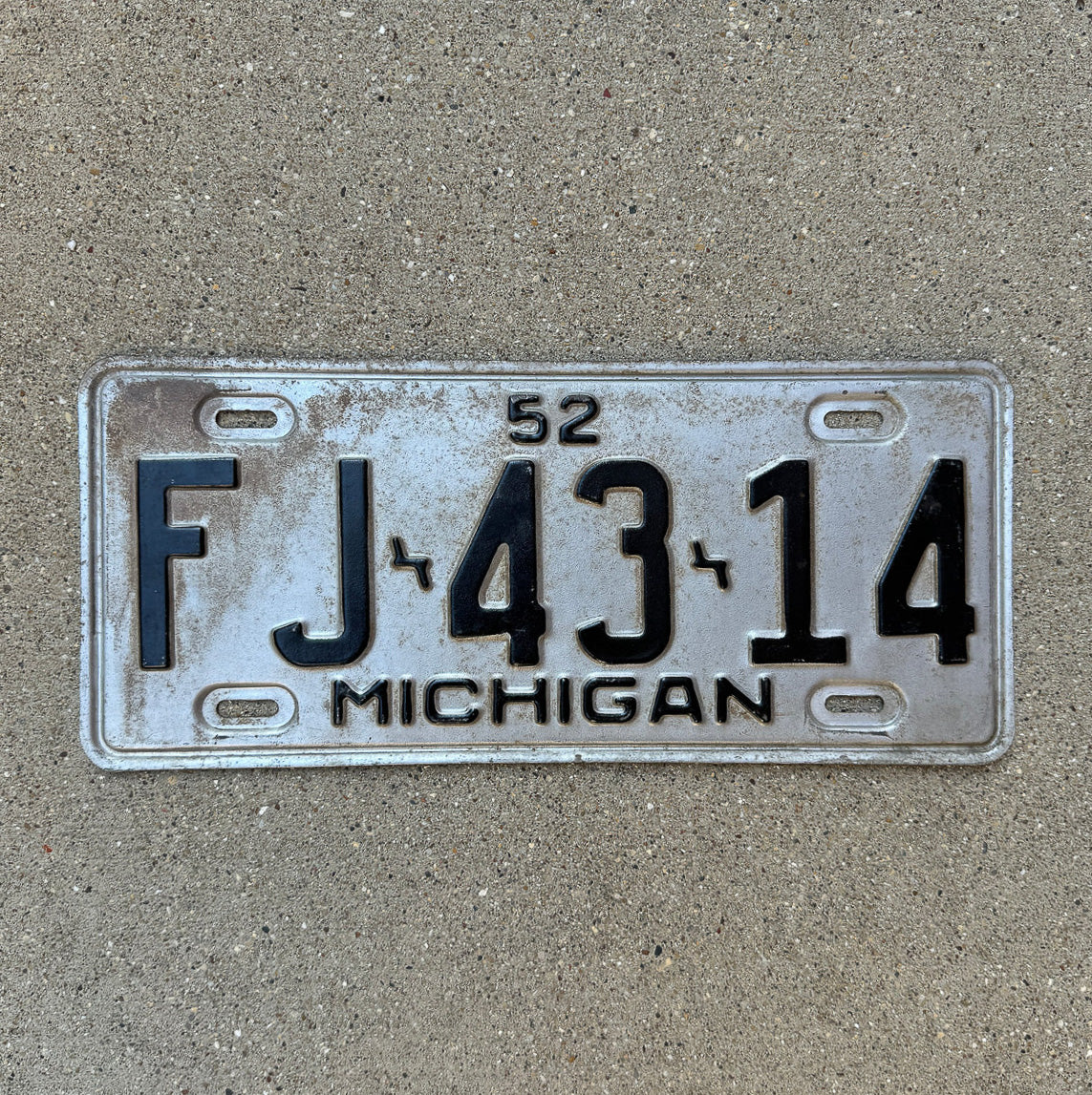 Photo of a 1952 Michigan License Plate Auto Tag Garage Decor Vintage FJ 43 14 with original patina