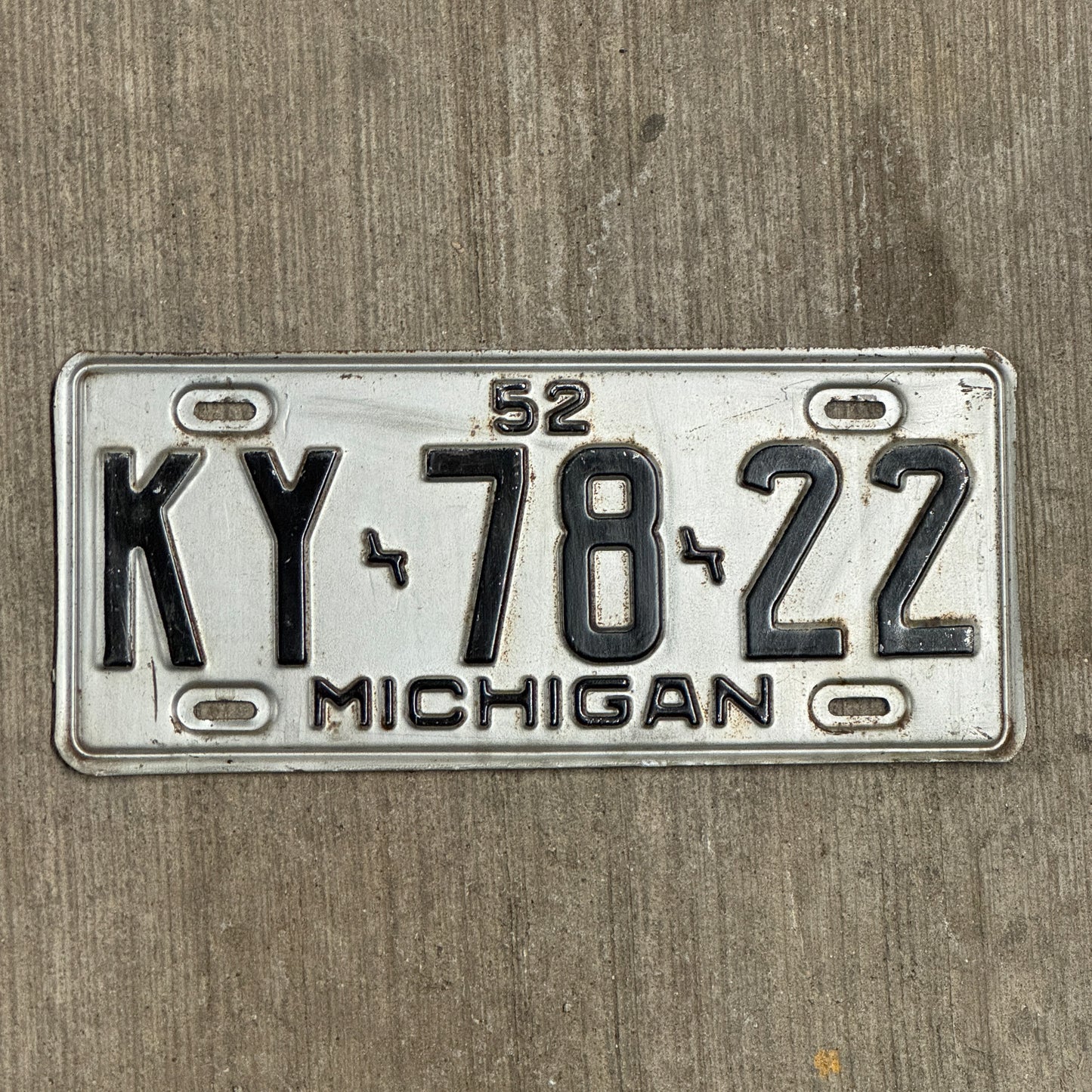 Photo of a 1952 Michigan License Plate Auto Tag Garage Decor Vintage KY 78 22 with original patina