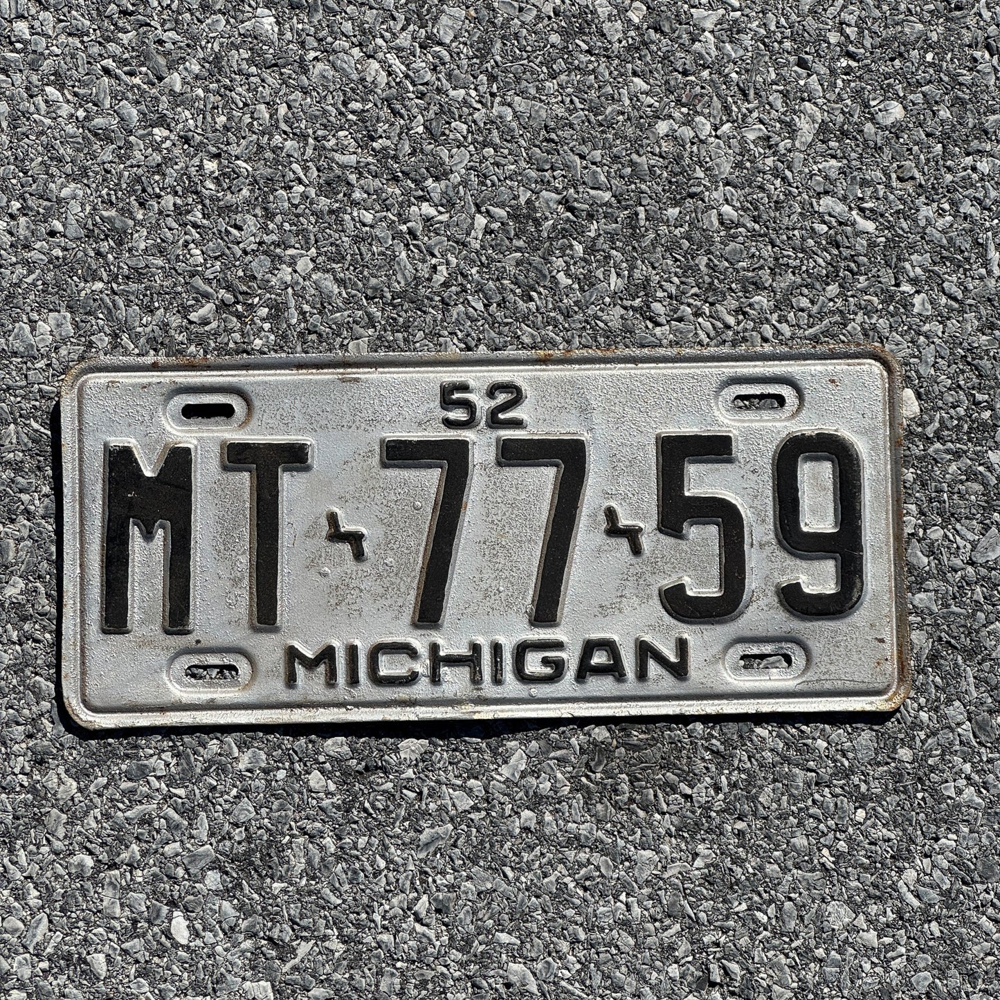 Photo of a 1952 Michigan License Plate Auto Tag Garage Decor Vintage MT7759