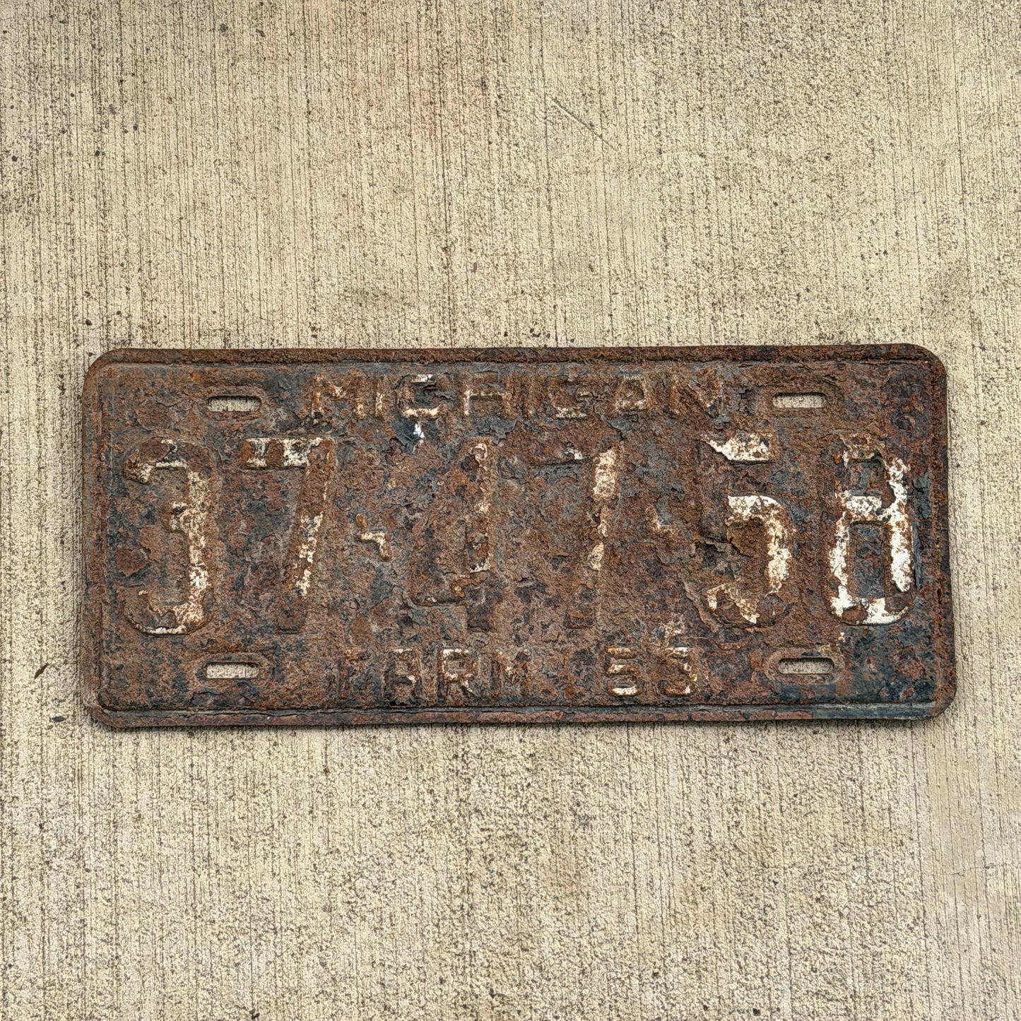 Photo of a 1953 Michigan Farm License Plate Auto Tag Garage Decor Vintage 37 47 58 with original patina