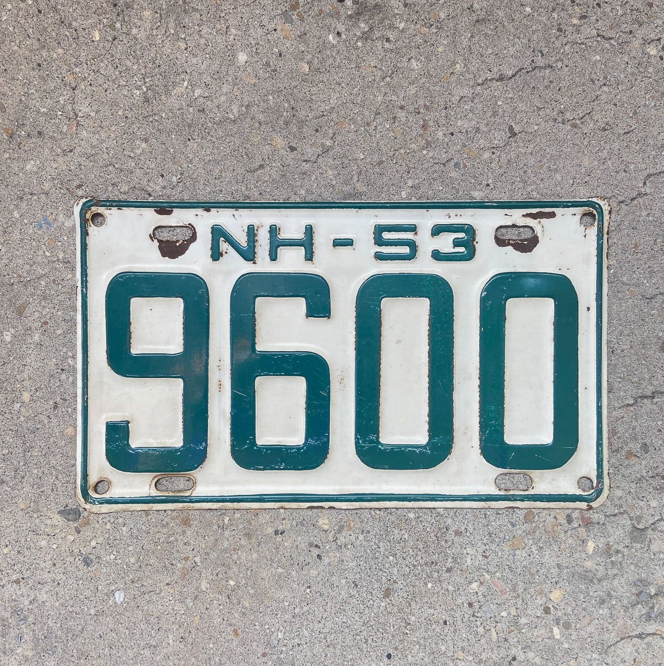 Photo of a 1953 New Hampshire License Plate Auto Tag Garage Decor Vintage Low Number Four Digit 9600 with original patina