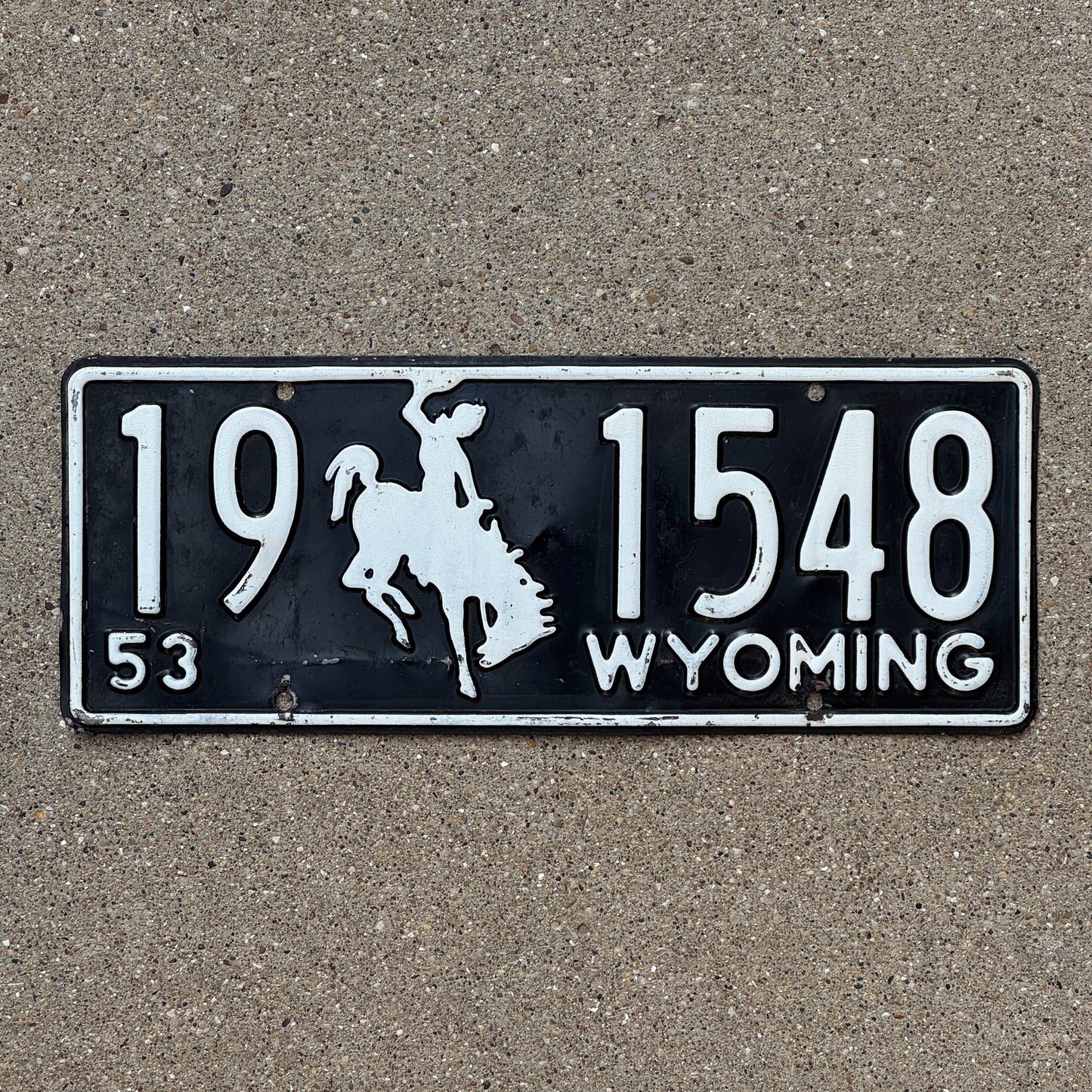 Photo of a 1953 Wyoming License Plate Auto Tag Garage Decor Vintage Cowboy Rodeo 19 1548 with original patina