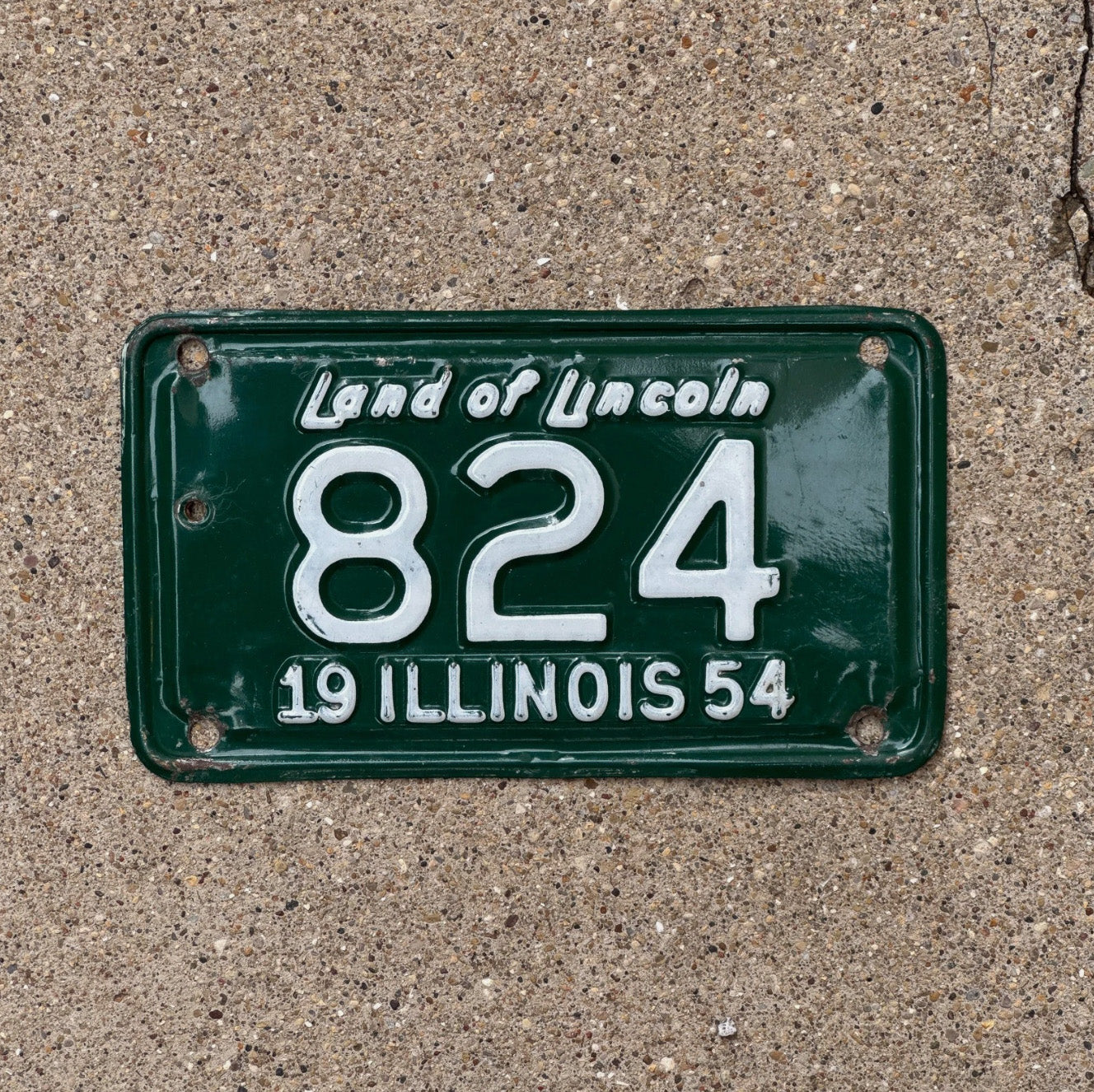 Photo of a 1954 Illinois Motorcycle License Plate Auto Tag Garage Decor Vintage Low Number Three Digit 824 with original patina