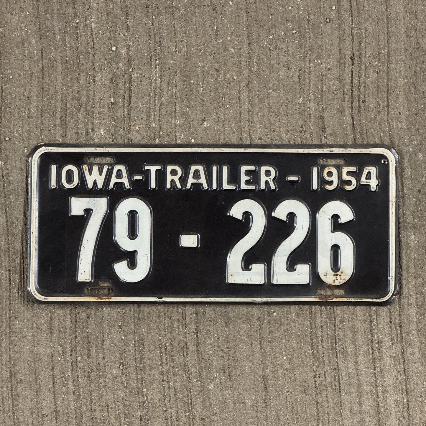Photo of a 1954 Iowa Trailer License Plate Auto Tag Garage Decor Vintage 79 226