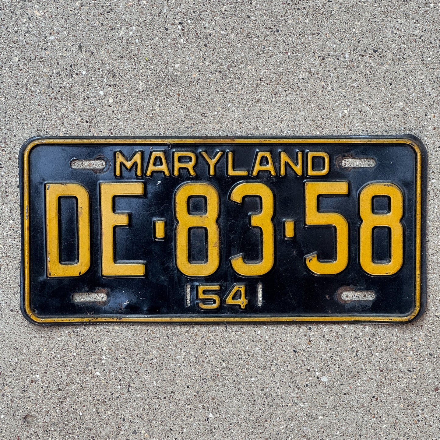 Photo of a 1954 Maryland License Plate Auto Tag Garage Decor Vintage DE 8358