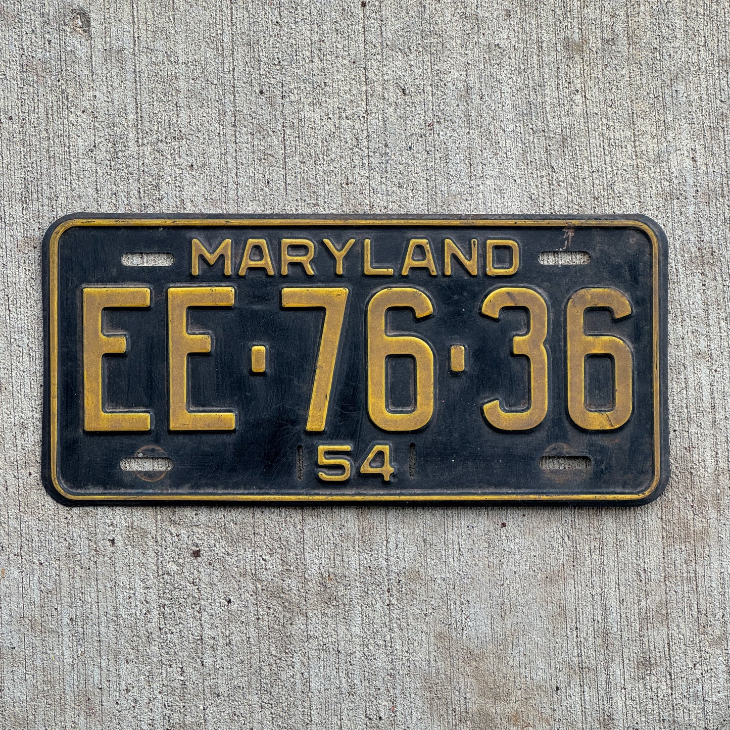 Photo of a 1954 Maryland License Plate Auto Tag Garage Decor Vintage EE 76 36 with original patina