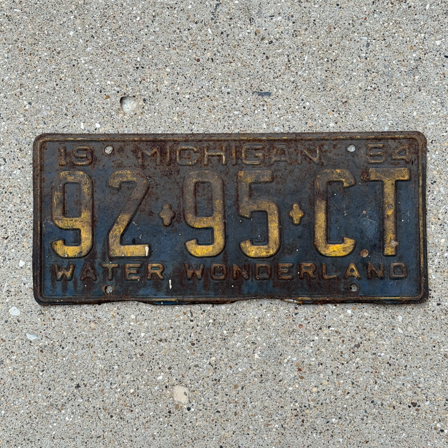Photo of a 1954 Michigan Commercial License Plate Auto Tag Garage Decor Vintage 92 95 CT with original patina