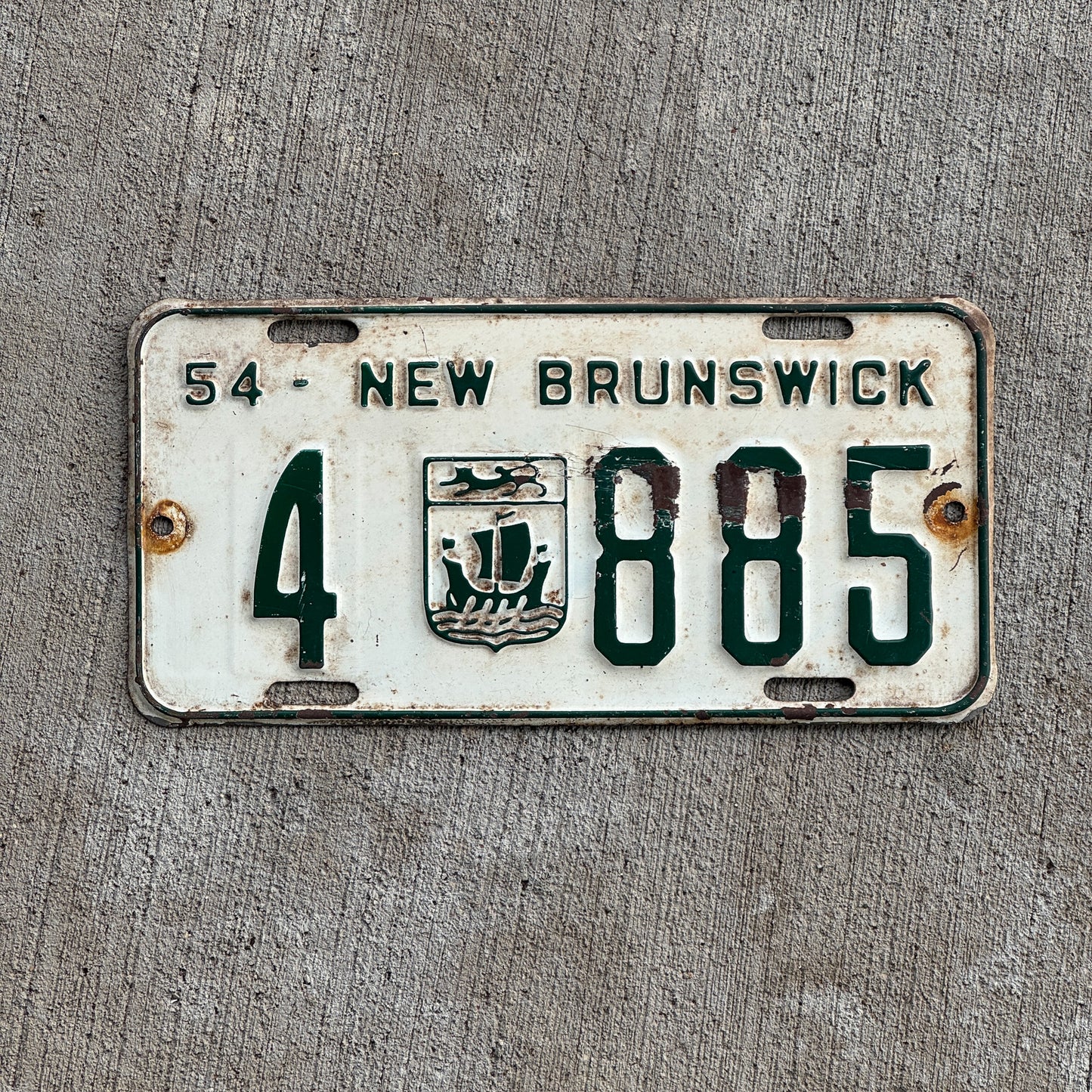 Photo of a 1954 New Brunswick License Plate Auto Tag Garage Decor Vintage 4 885 with original patina