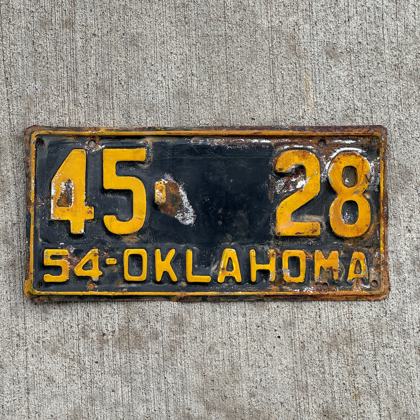 Photo of a 1954 Oklahoma License Plate Auto Tag Garage Decor Vintage Blaine County Low Number 45 28 with original patina