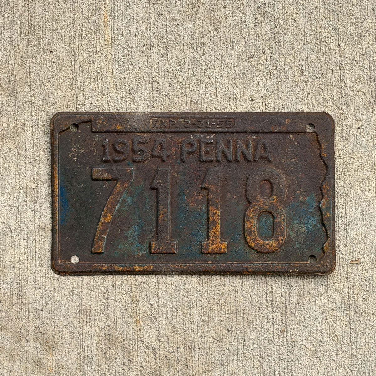 Photo of a 1954 Pennsylvania License Plate Auto Tag Garage Decor Vintage Low Number Four Digit 7118 with original patina