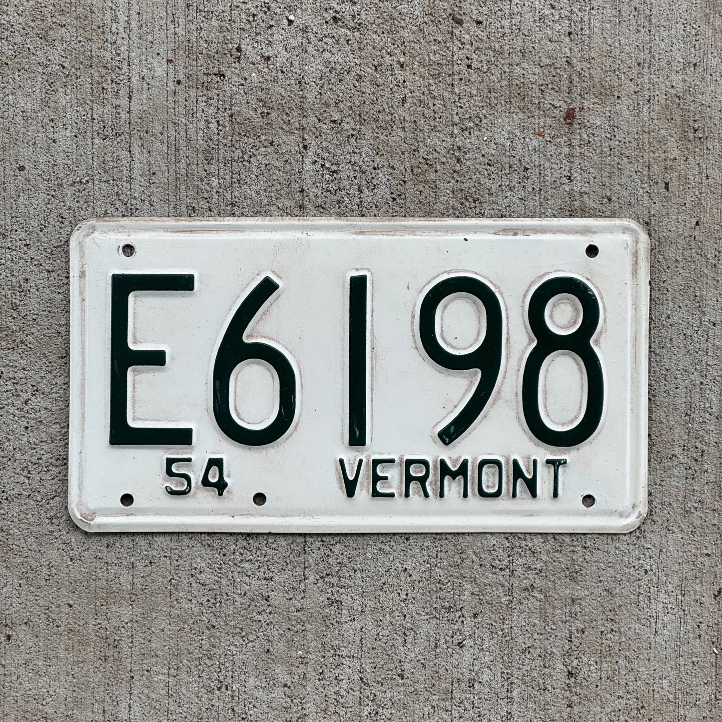 Photo of a 1954 Vermont License Plate Auto Tag Garage Decor Vintage E 6198 with original patina