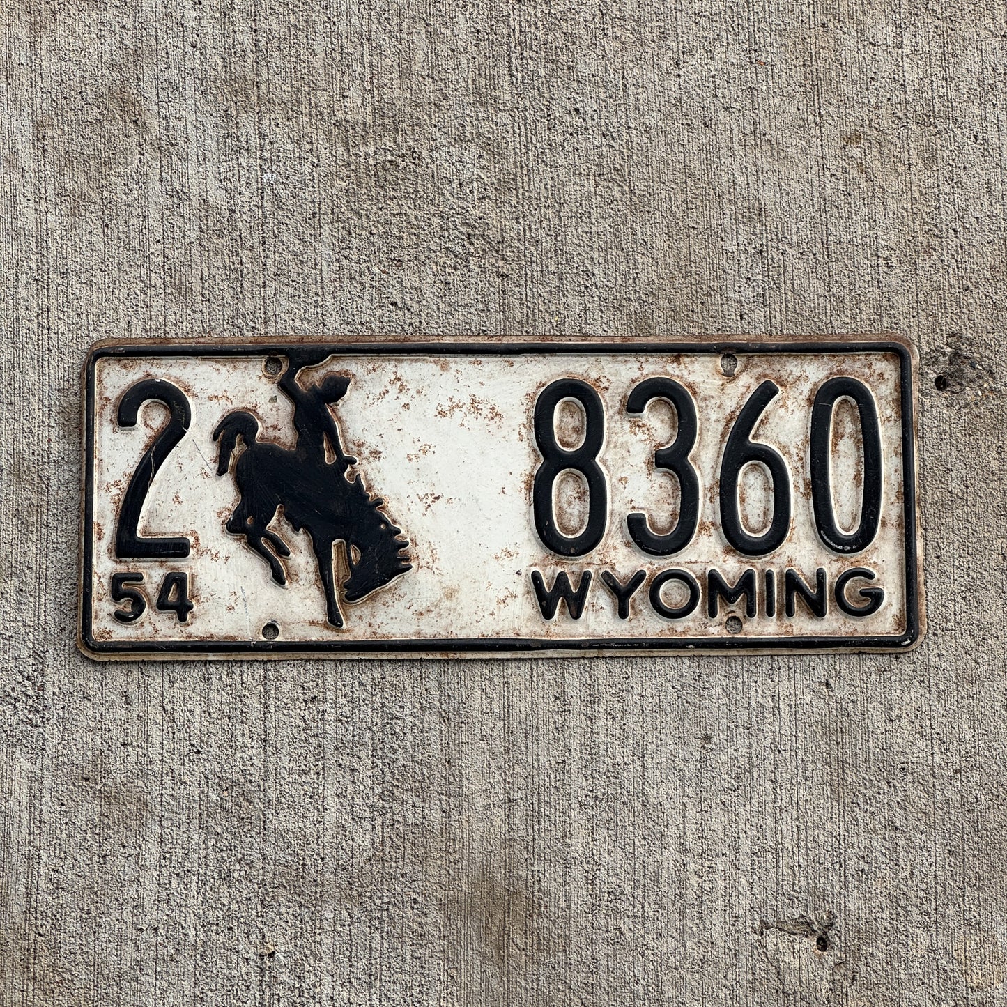 Photo of a 1954 Wyoming License Plate Auto Tag Garage Decor Vintage Bronco Cowboy 2 8360 with original patina